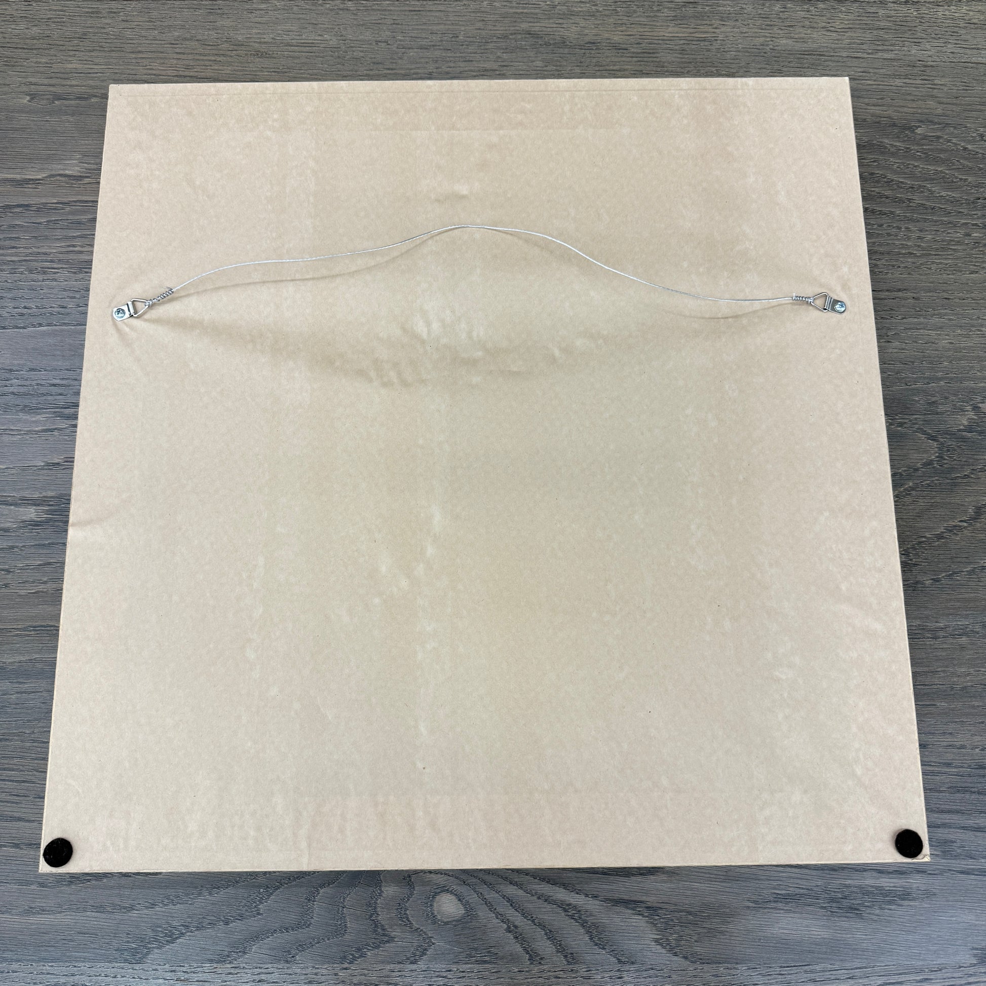 Framed Painting: Allison Caesar Mixed Media - Untitled by Artist features gray, beige, and yellow with circular forms, splatters, and dark spots on a textured background. This elegant artwork enhances any space.