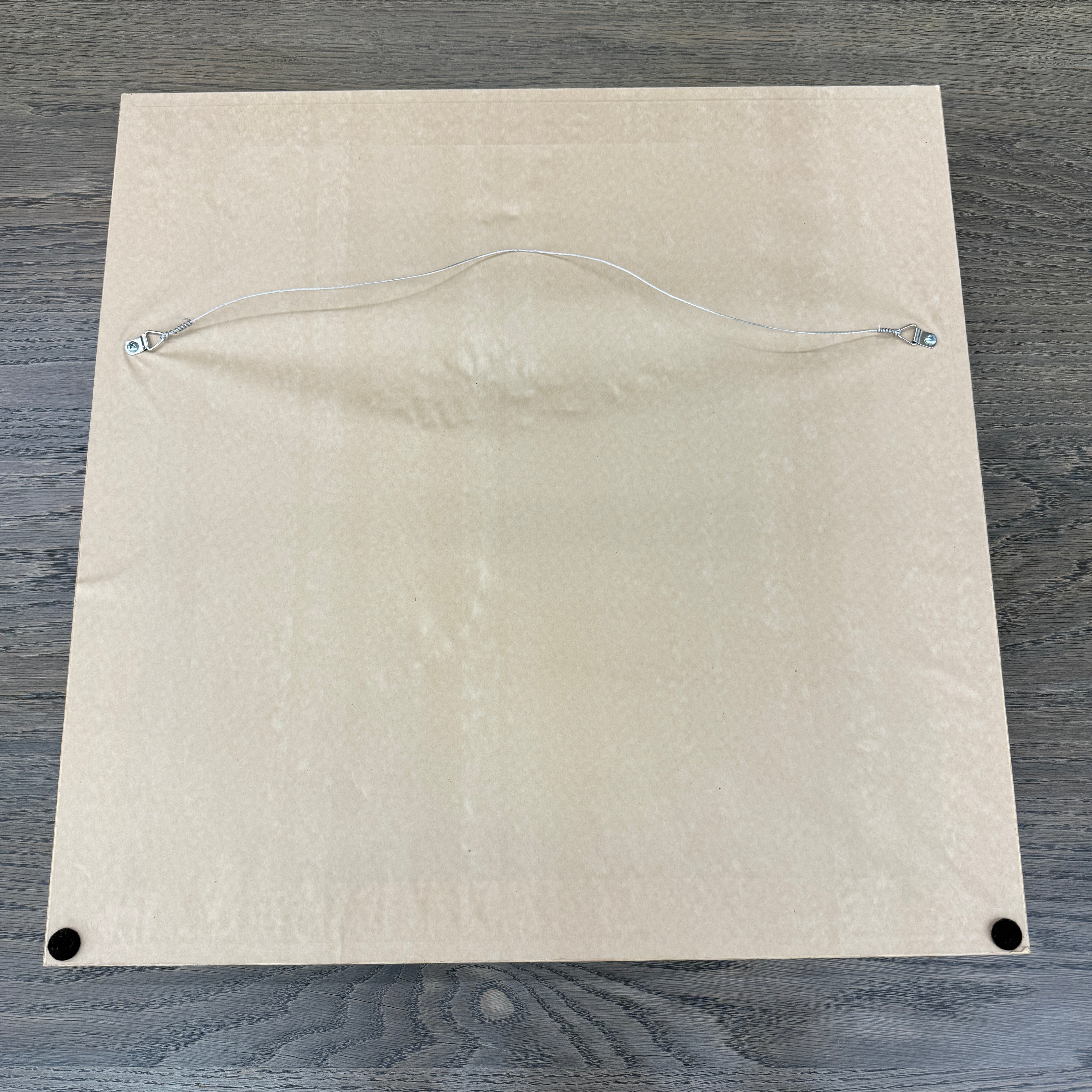 Framed Painting: Allison Caesar Mixed Media - Untitled by Artist features gray, beige, and yellow with circular forms, splatters, and dark spots on a textured background. This elegant artwork enhances any space.