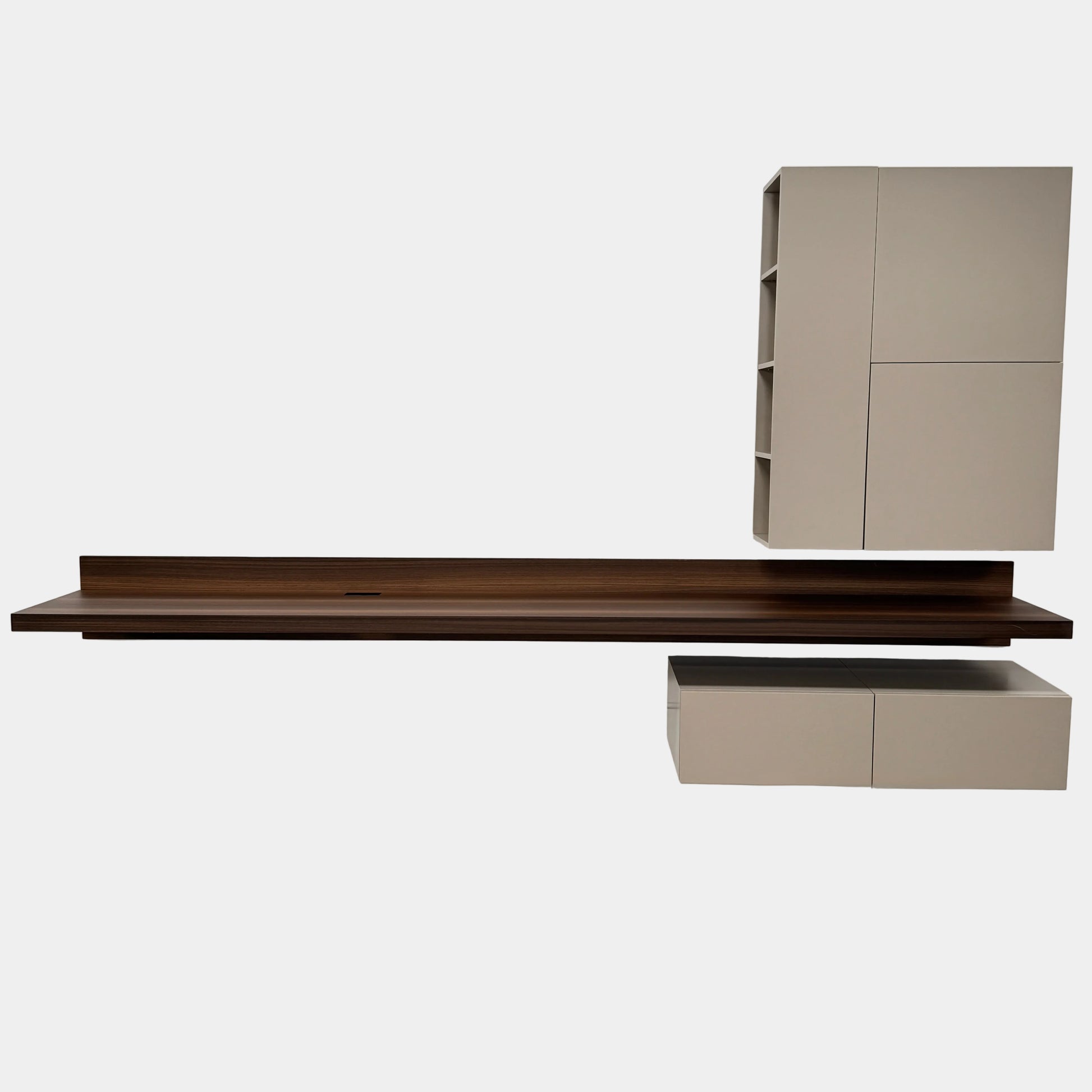 The Molteni & C Fortepiano Wall-mounted Desk System features a long wooden shelf, beige storage cabinets, and drawers for a sleek, modern look against a white wall.
