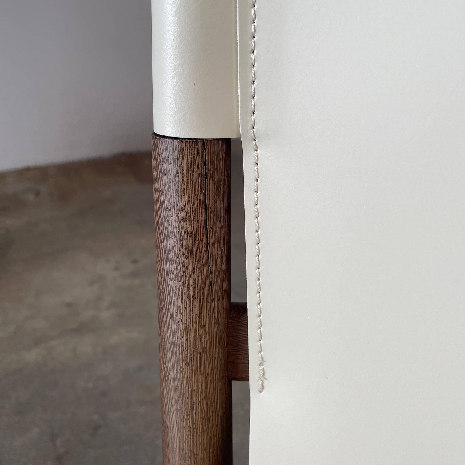 A B&B Italia Jens Dining Chair Set by B&B Italia is arranged in two rows against a plain background, featuring white cushions and wooden frames.