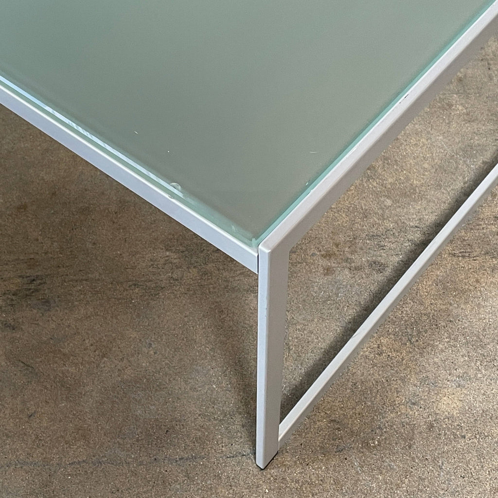 An Italian Vintage Frosted Glass Coffee Table with metal legs on a white background.