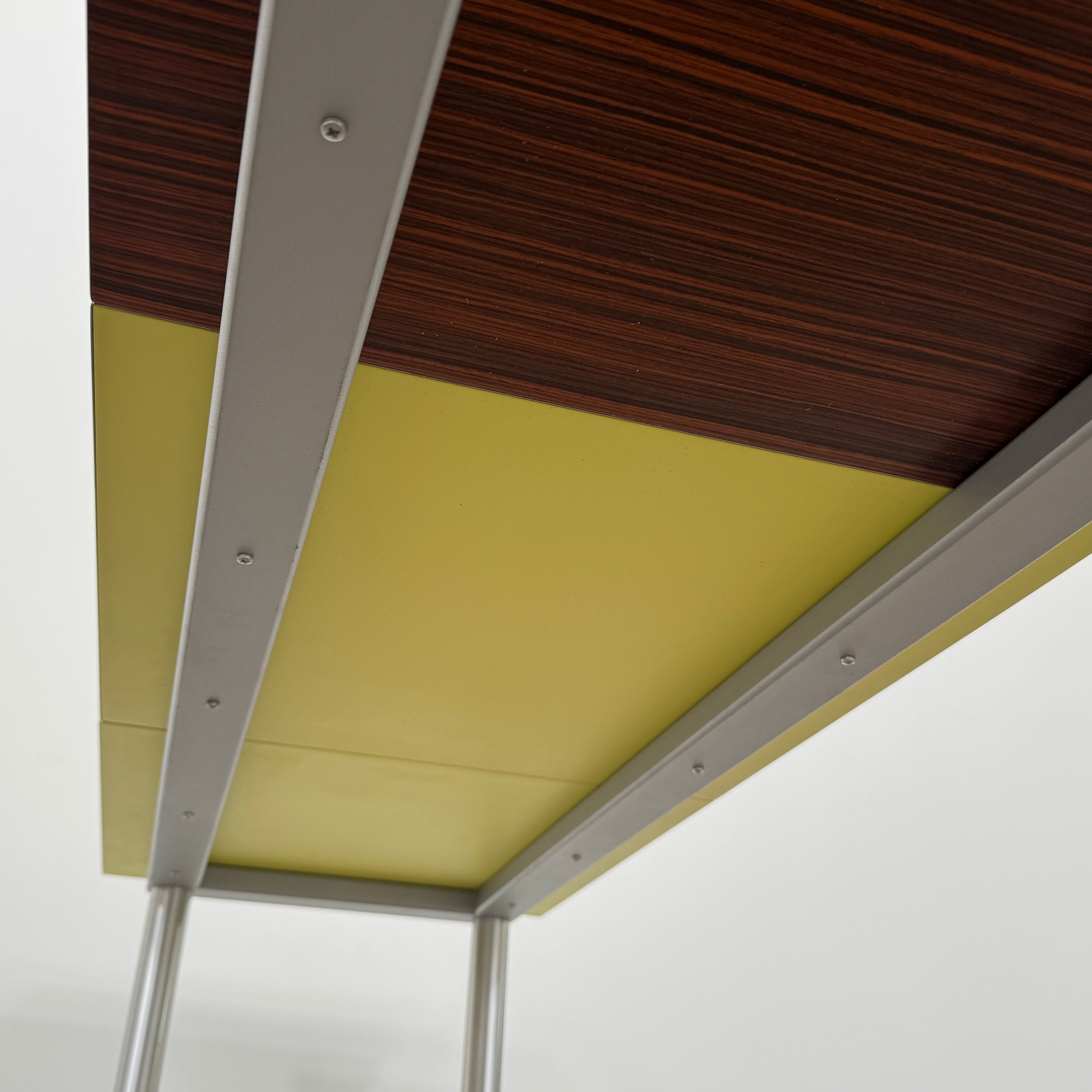 A Mazzei Multi-Panel Table with a contemporary design featuring yellow, orange, and blue stripes.