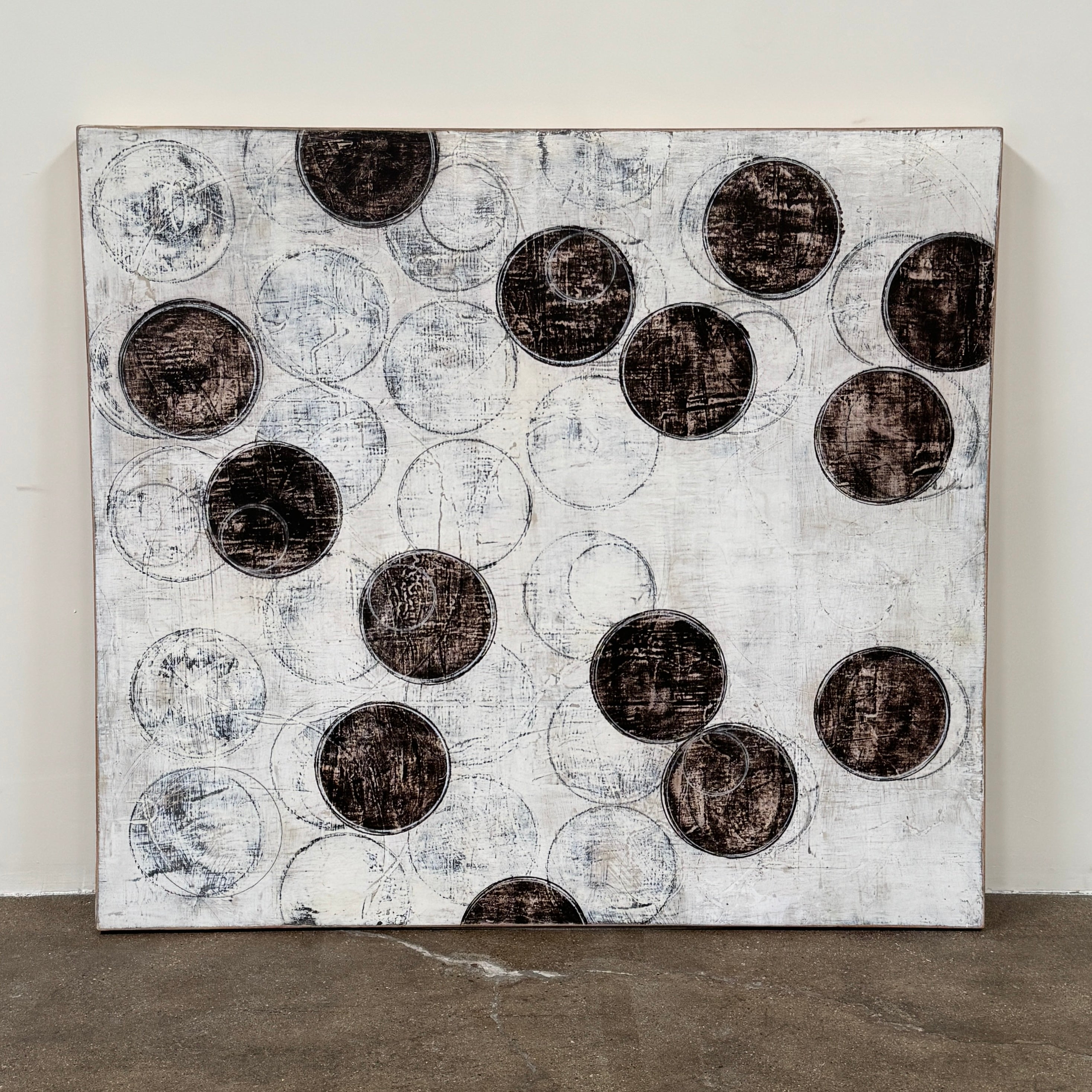 Painting: Circles by Ron Piler from Artist features overlapping black and white abstract forms on a textured white background—perfect for display against a wall, reminiscent of modern gallery pieces.