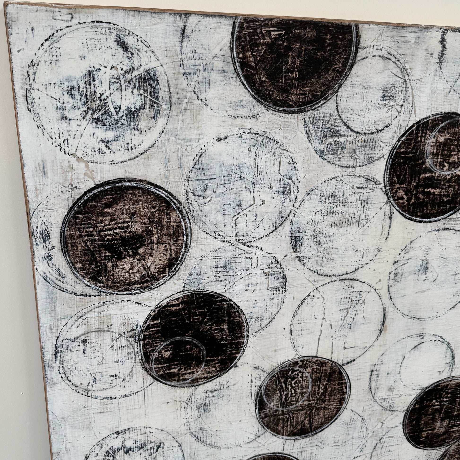 Painting: Circles by Ron Piler from Artist features overlapping black and white abstract forms on a textured white background—perfect for display against a wall, reminiscent of modern gallery pieces.
