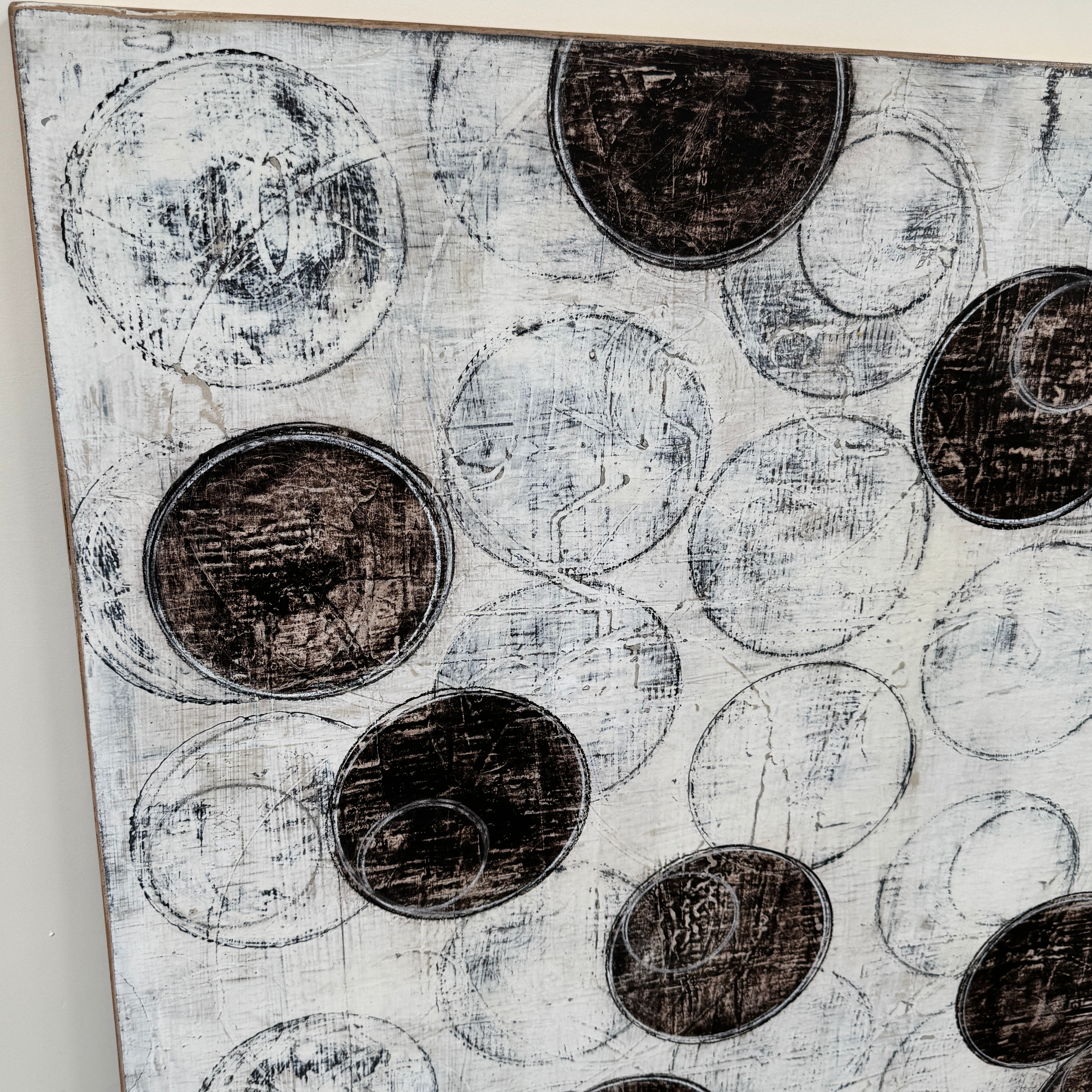Painting: Circles by Ron Piler from Artist features overlapping black and white abstract forms on a textured white background—perfect for display against a wall, reminiscent of modern gallery pieces.