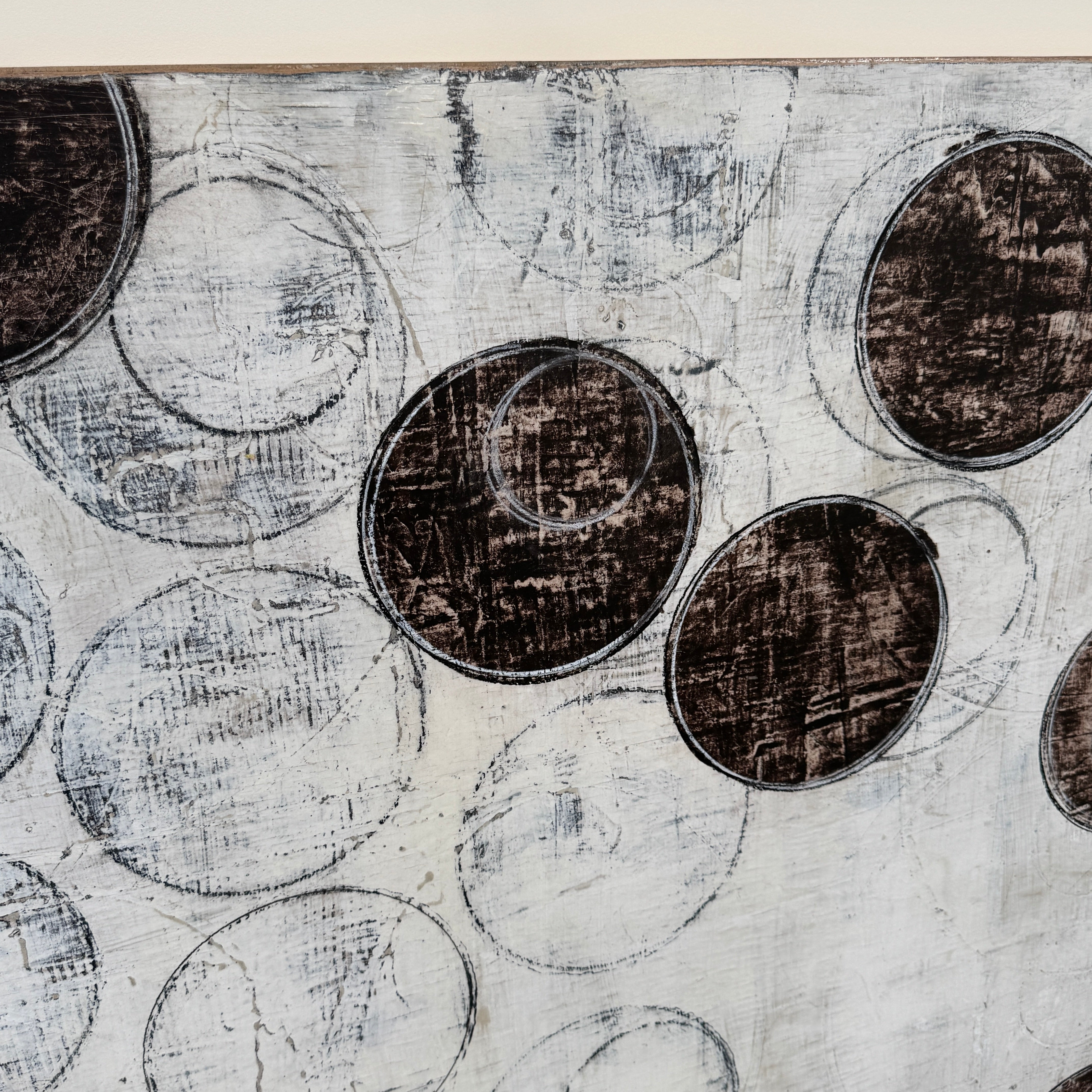 Painting: Circles by Ron Piler from Artist features overlapping black and white abstract forms on a textured white background—perfect for display against a wall, reminiscent of modern gallery pieces.