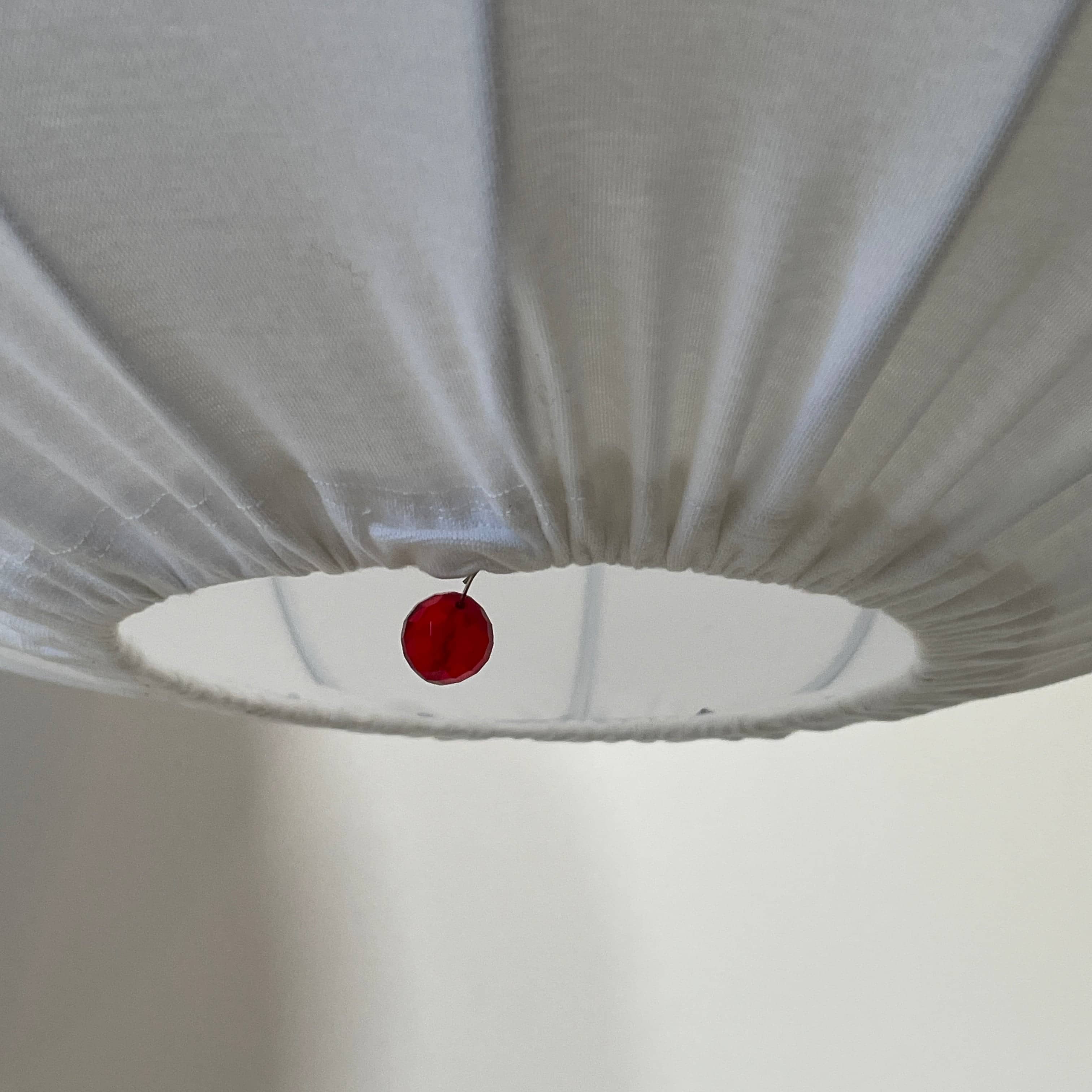A Penta Balloon Light hanging lamp on a white wall.
