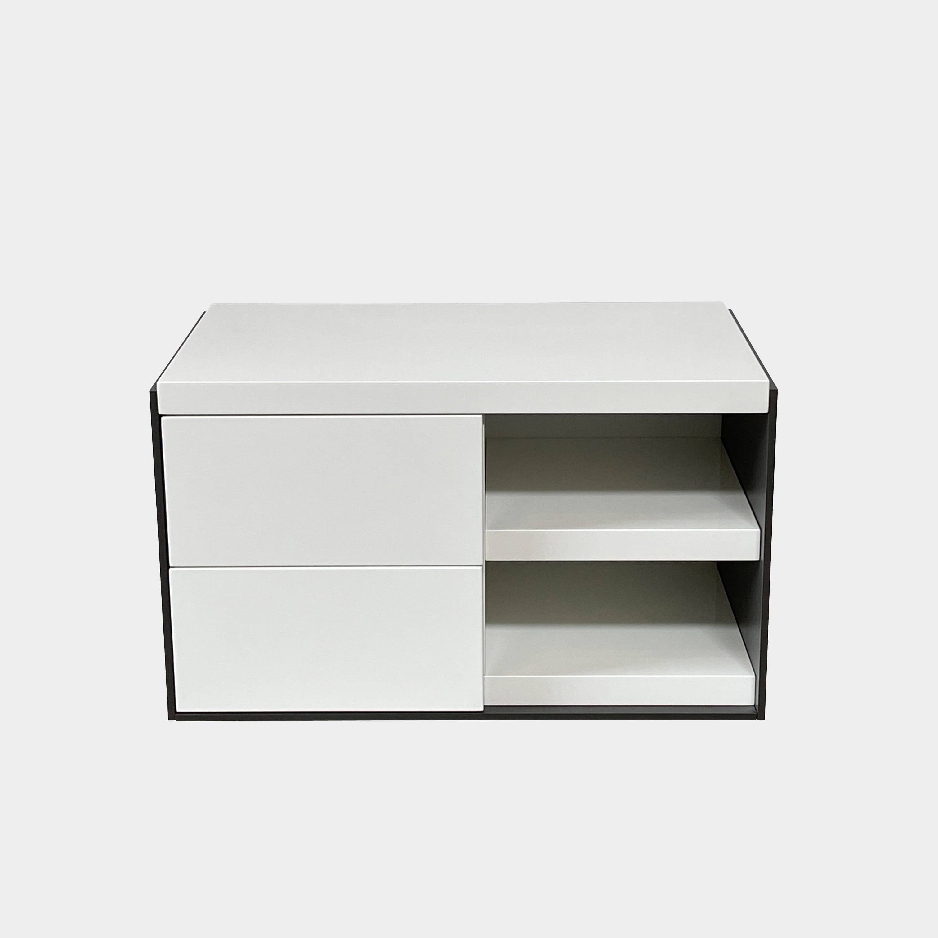 Two identical B&B Italia Surface Nightstands by B&B Italia, in a chic white finish with black trim, each featuring two drawers and open shelving in the middle. These modern pieces are perfect for any contemporary bedroom furniture arrangement.