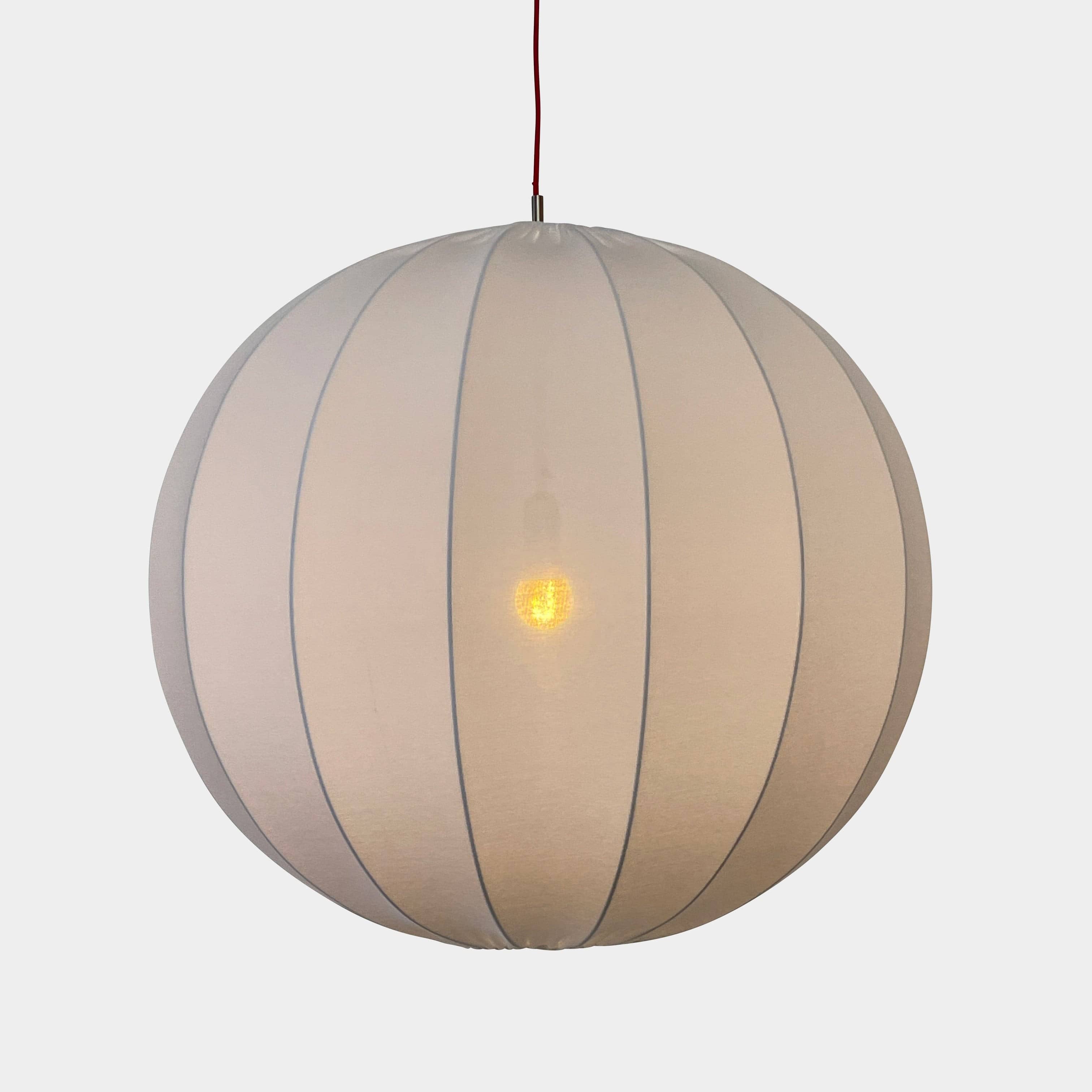 A Penta Balloon Light hanging lamp on a white wall.