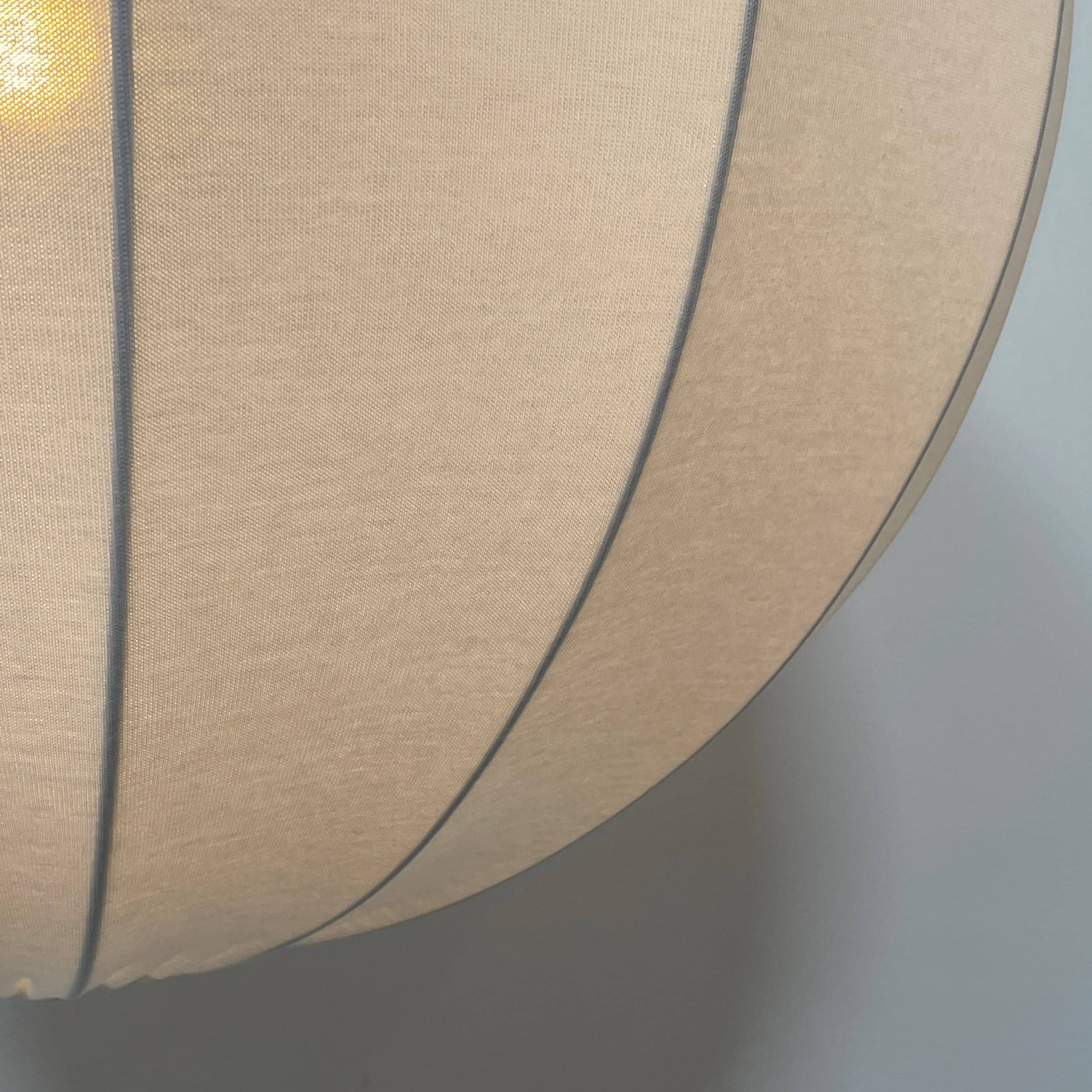 A Penta Balloon Light hanging lamp on a white wall.