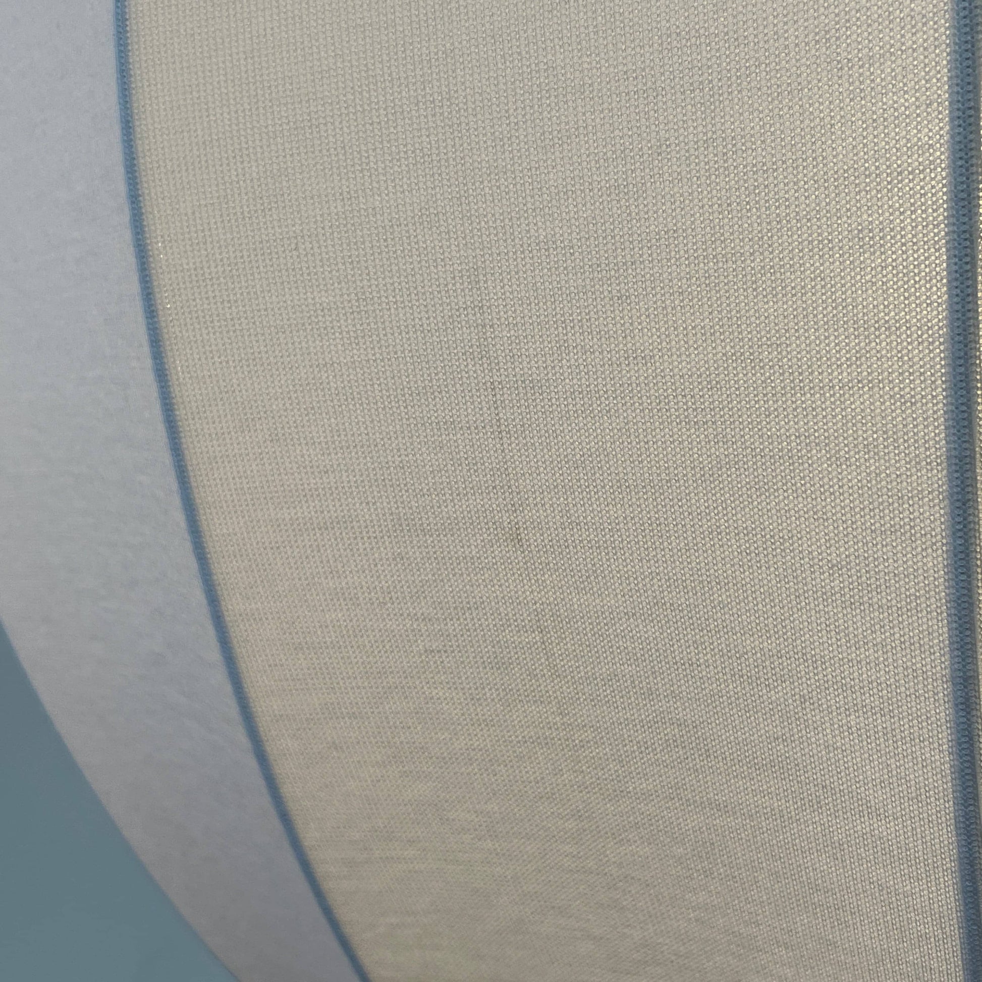 A Penta Balloon Light hanging lamp on a white wall.