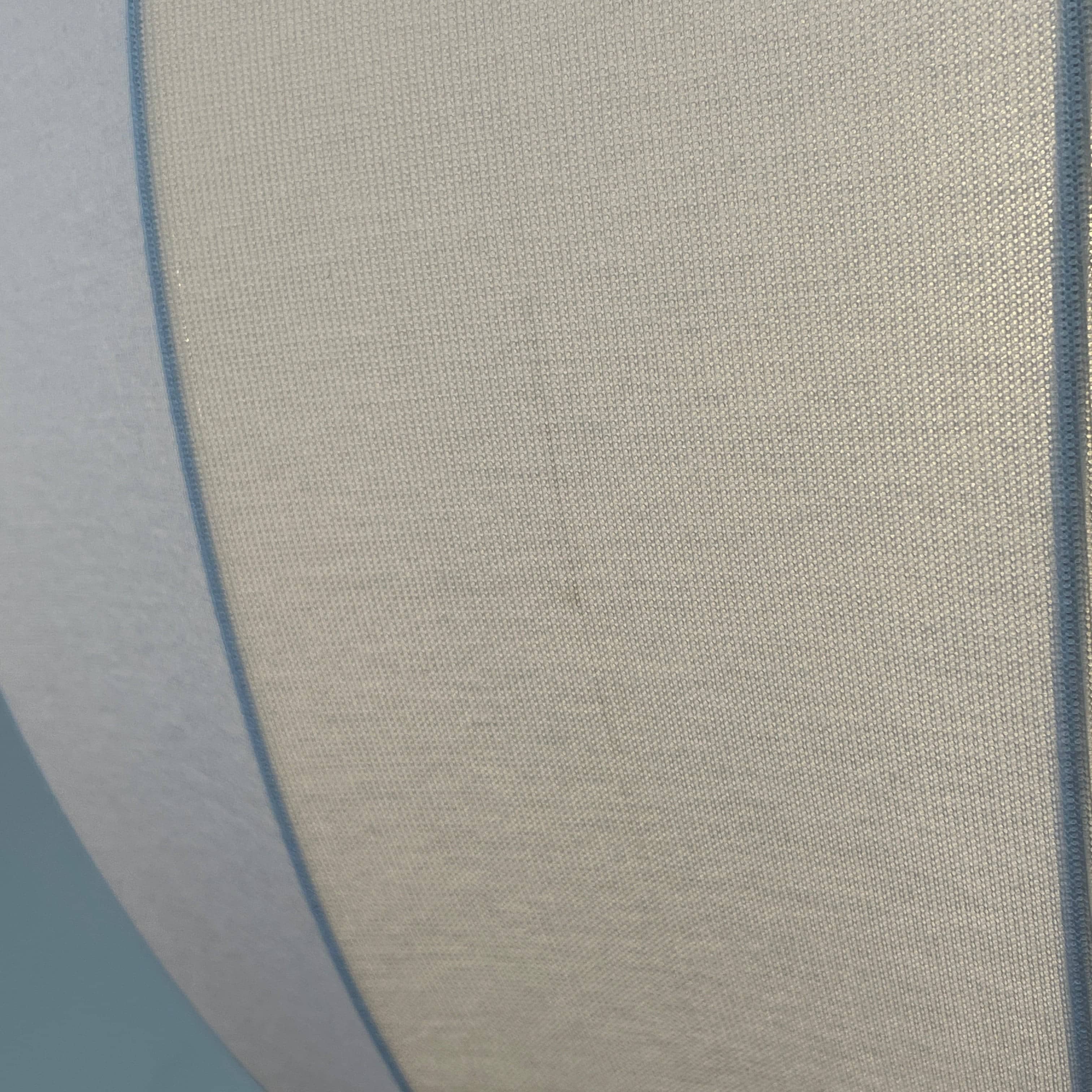 A Penta Balloon Light hanging lamp on a white wall.