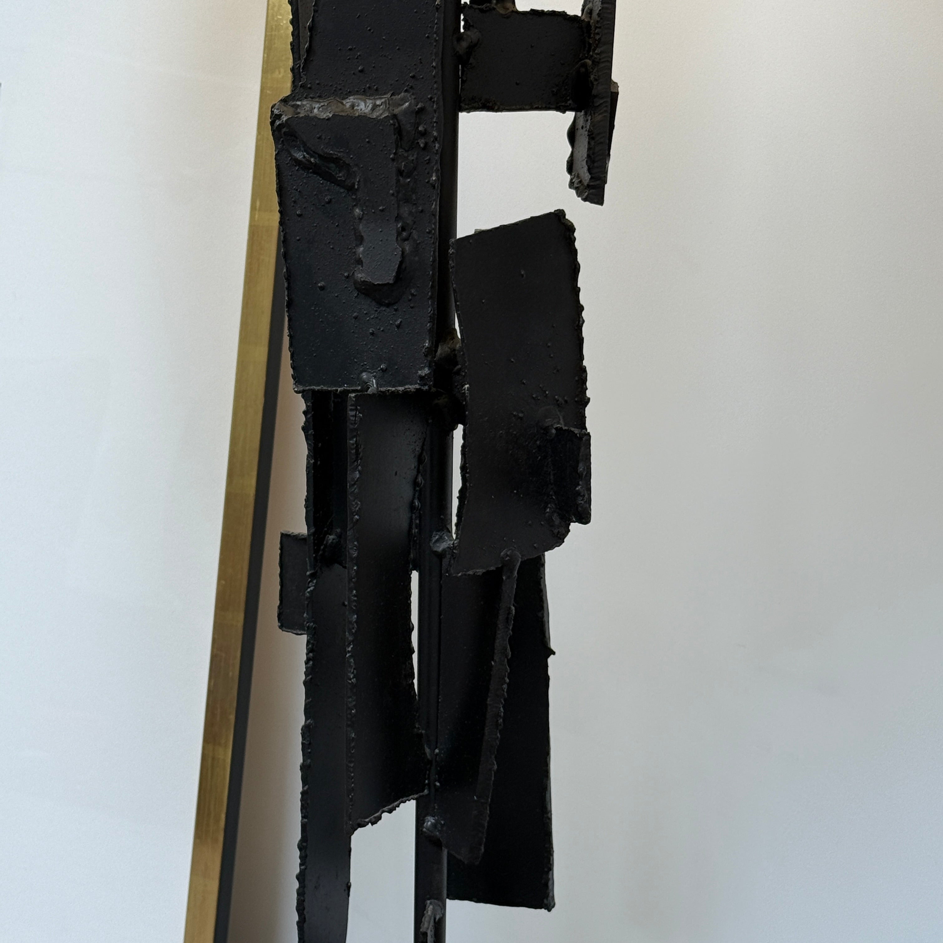 A pair of Vintage Richard Barr Iron Brutalist table lamps for Laurel Lamp Co., featuring abstract black metal bases and cylindrical white shades, set against a plain white background.