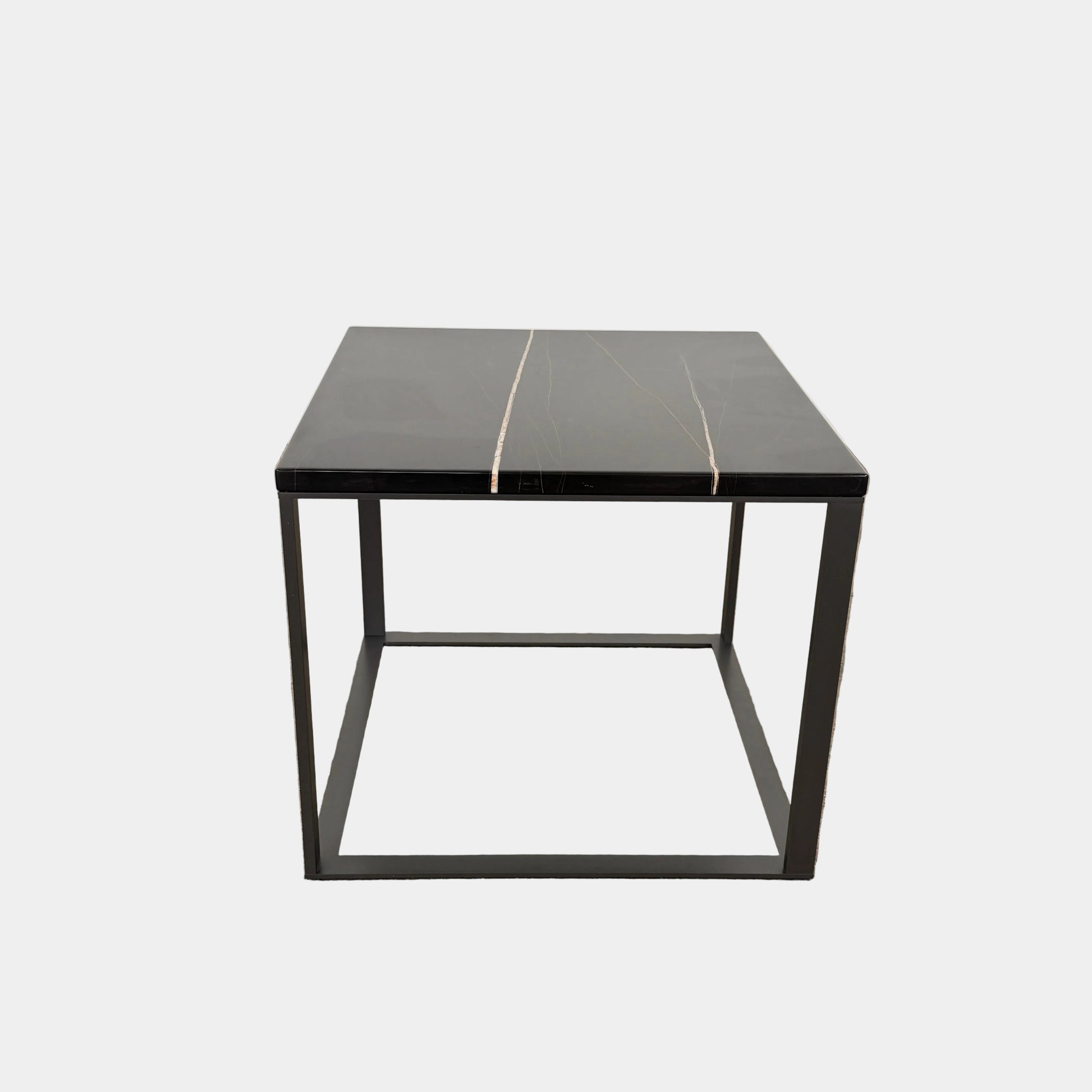 The Maxalto Lithos Side Table Sahara Noir Marble Top by Maxalto features a square black frame designed by Antonio Citterio and a marble top with subtle light veining.