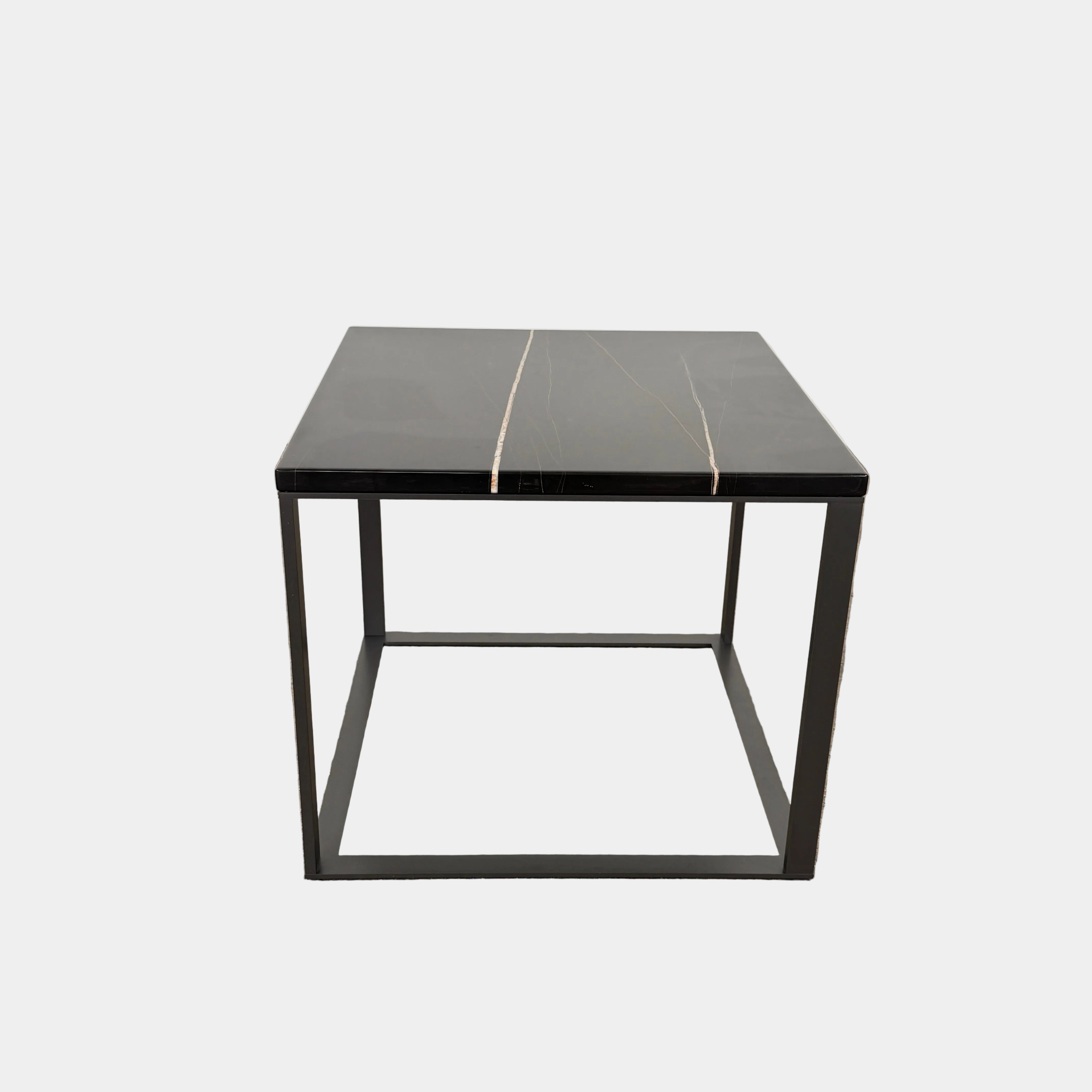 The Maxalto Lithos Side Table Sahara Noir Marble Top by Maxalto features a square black frame designed by Antonio Citterio and a marble top with subtle light veining.