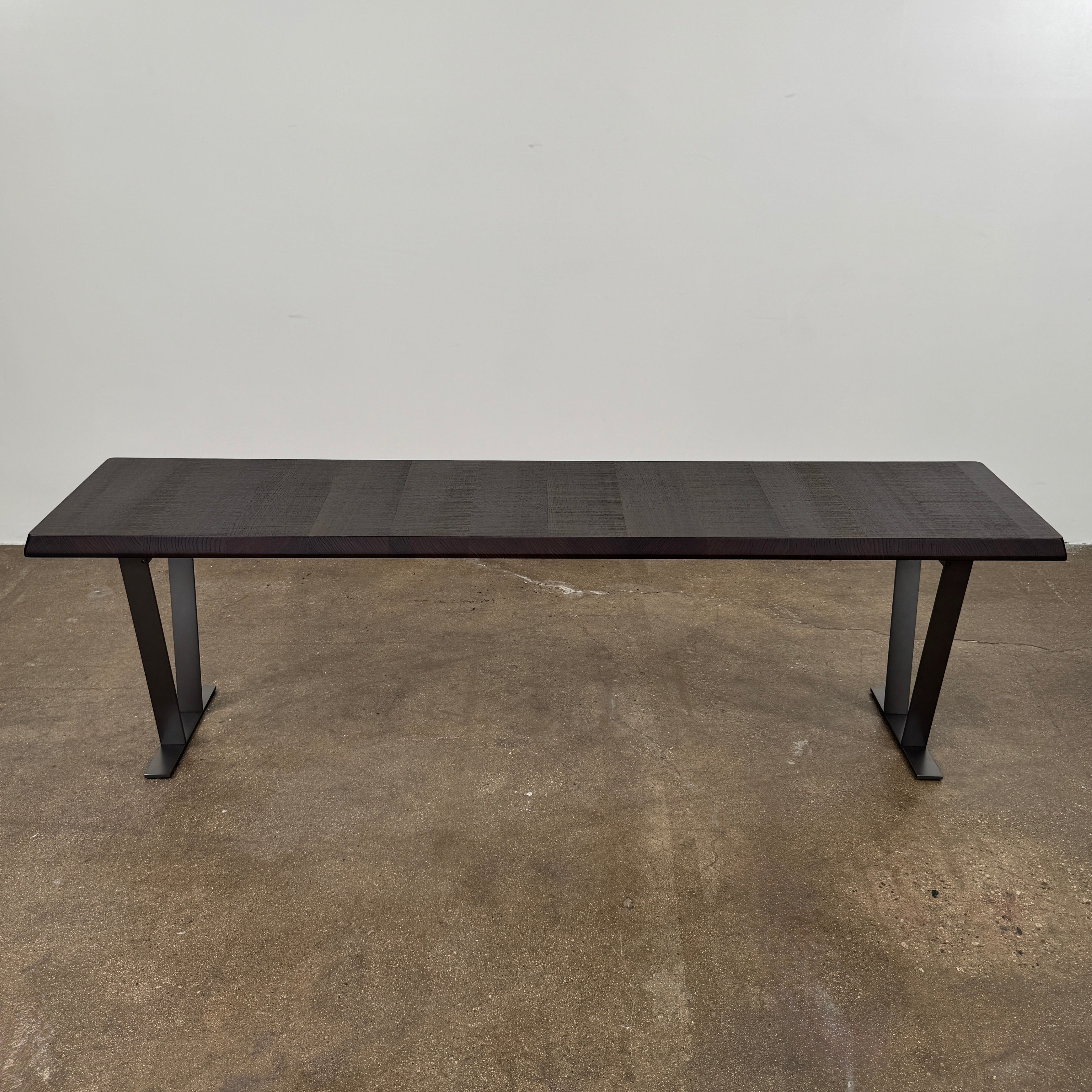 A modern luxury, rectangular wooden B&B Italia Luis Bench with angled metal legs by B&B Italia, shown on a plain white background and inspired by the refined aesthetic of Antonio Citterio.