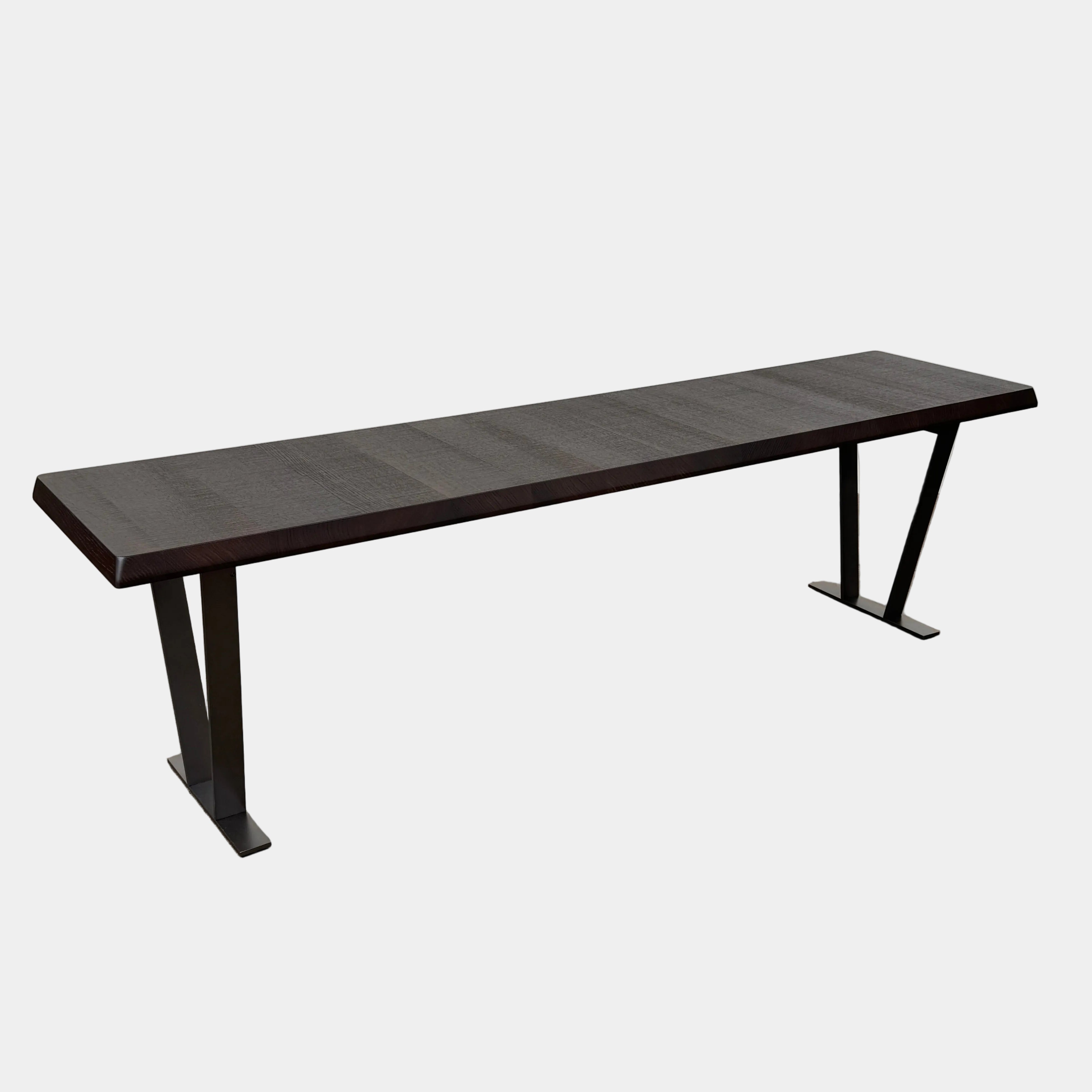 A modern luxury, rectangular wooden B&B Italia Luis Bench with angled metal legs by B&B Italia, shown on a plain white background and inspired by the refined aesthetic of Antonio Citterio.