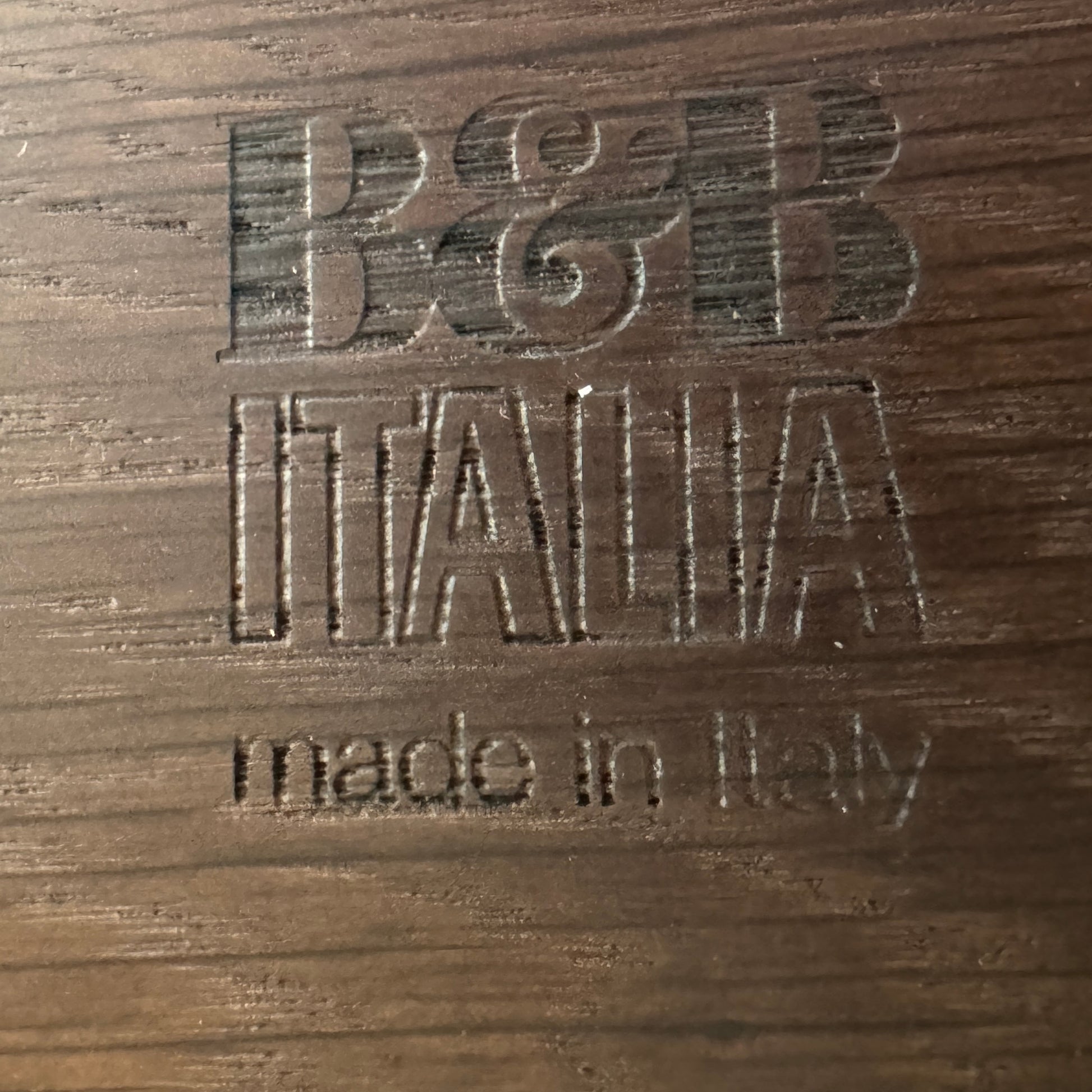 A modern luxury, rectangular wooden B&B Italia Luis Bench with angled metal legs by B&B Italia, shown on a plain white background and inspired by the refined aesthetic of Antonio Citterio.