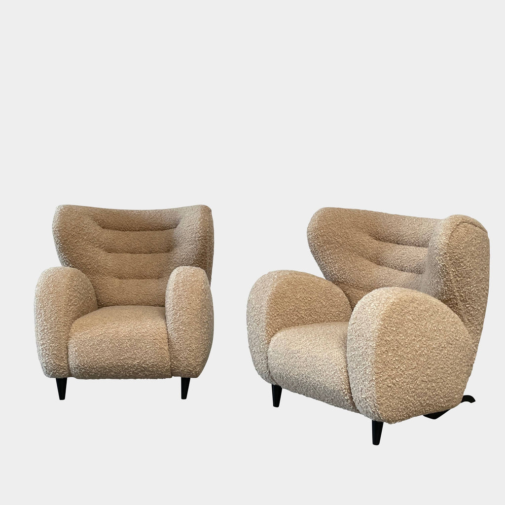 A pair of Pierre Augustin Rose Le Minotaure Armchairs on a white background by Pierre Augustin Rose.