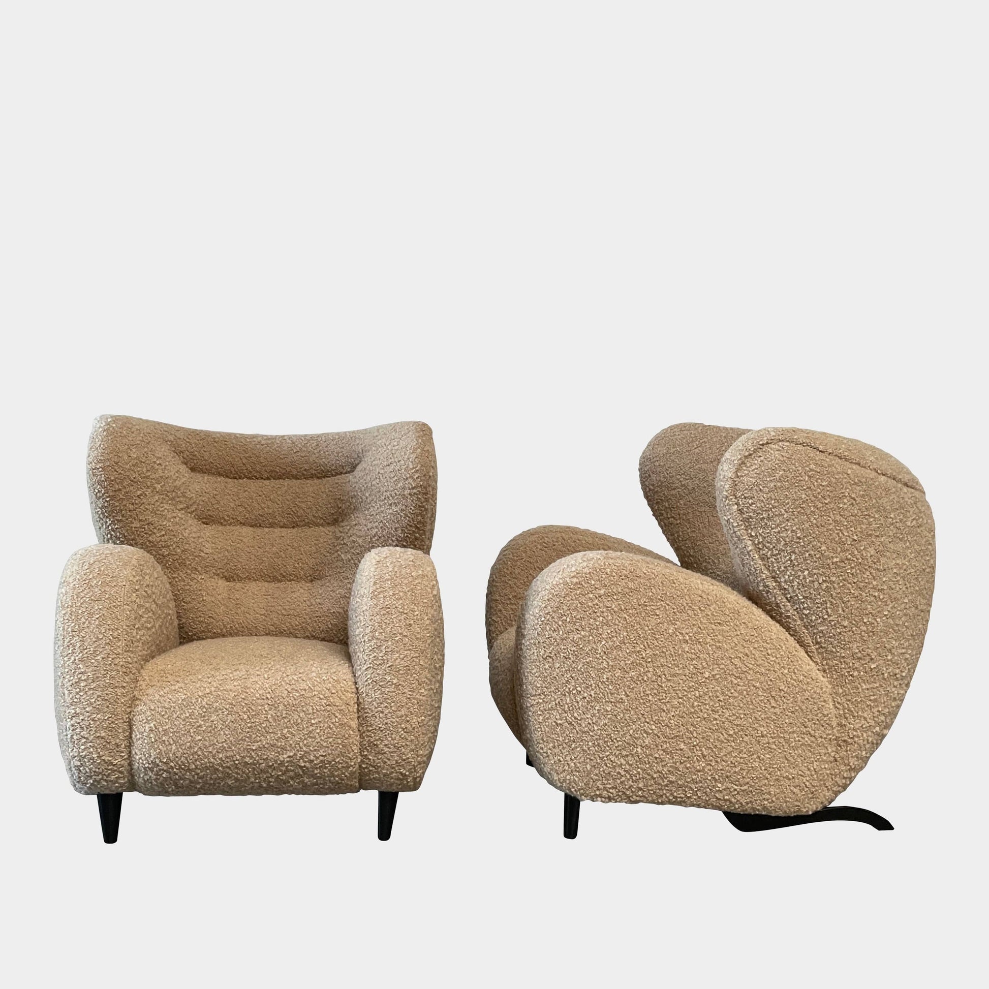 A pair of Pierre Augustin Rose Le Minotaure Armchairs on a white background by Pierre Augustin Rose.