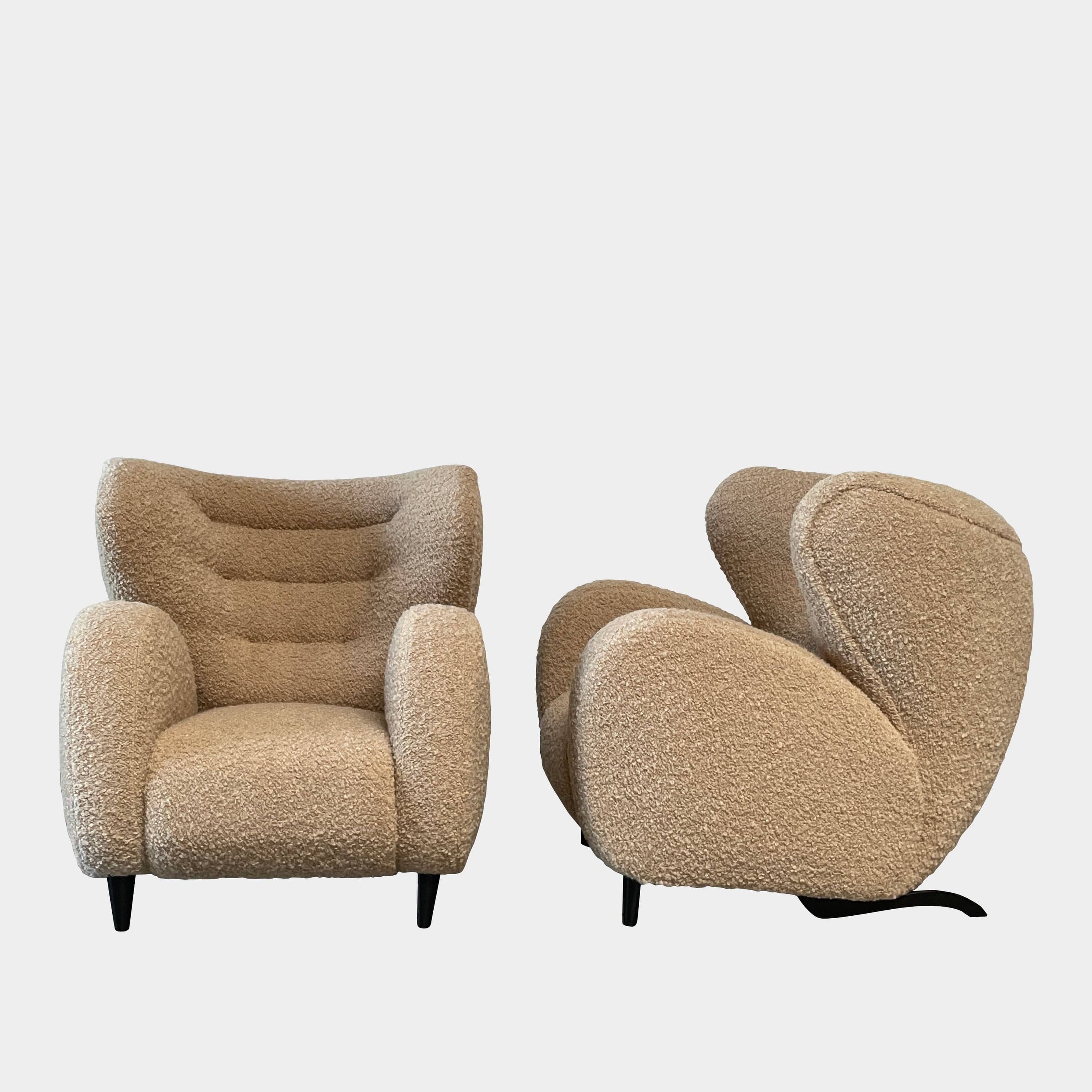 A pair of Pierre Augustin Rose Le Minotaure Armchairs on a white background by Pierre Augustin Rose.