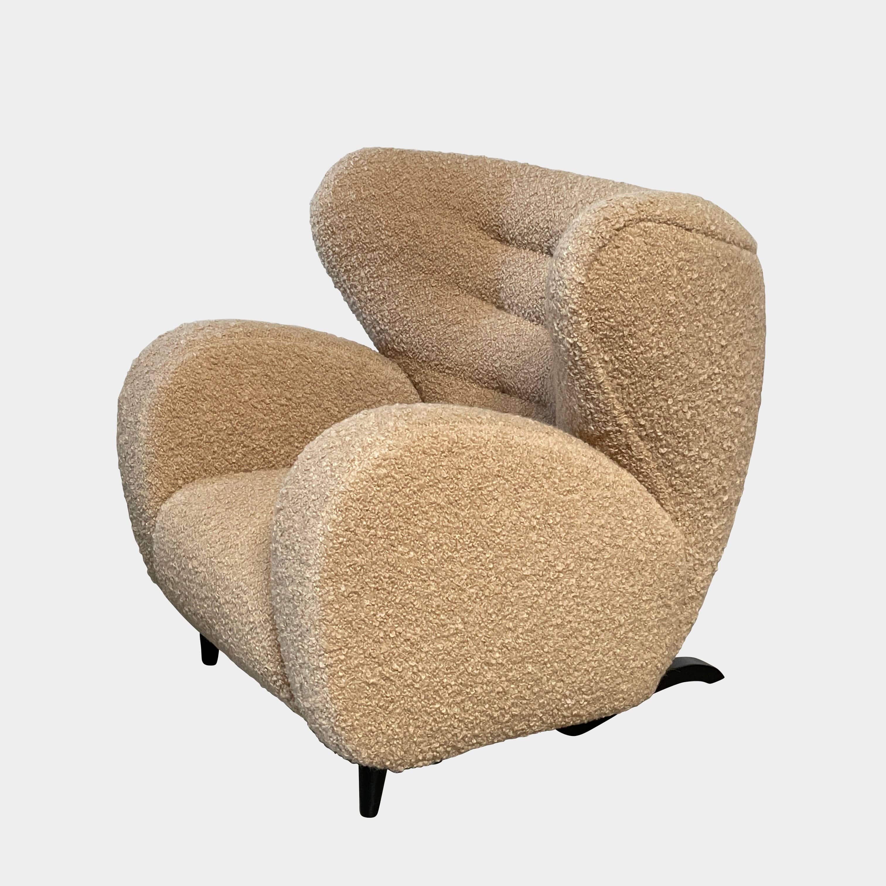 A pair of Pierre Augustin Rose Le Minotaure Armchairs on a white background by Pierre Augustin Rose.