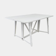 The Gervasoni Gray 51 Console/Table by Gervasoni, featuring a rectangular white design with a simple support frame, stands on a brown concrete floor against a plain white wall.
