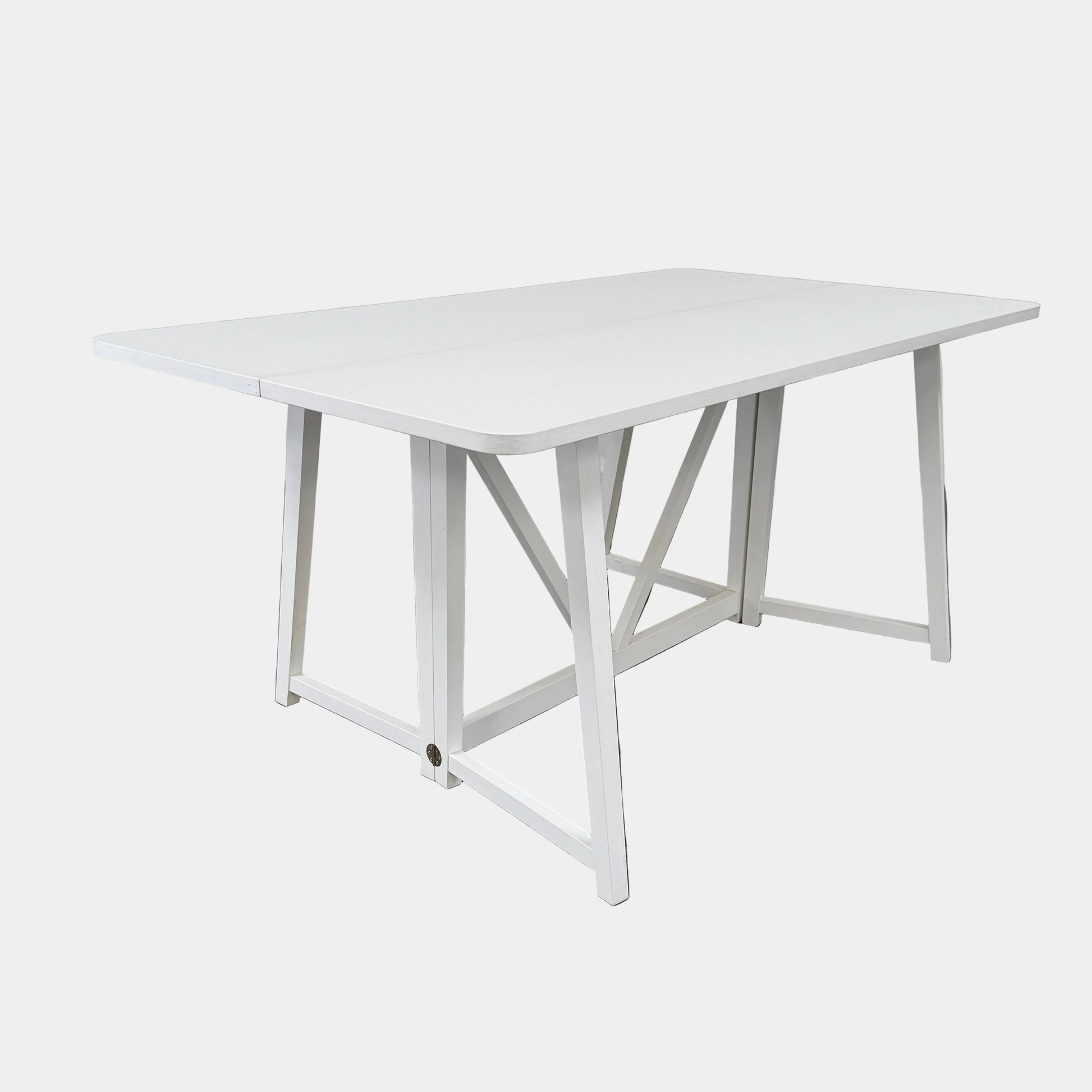 The Gervasoni Gray 51 Console/Table by Gervasoni, featuring a rectangular white design with a simple support frame, stands on a brown concrete floor against a plain white wall.