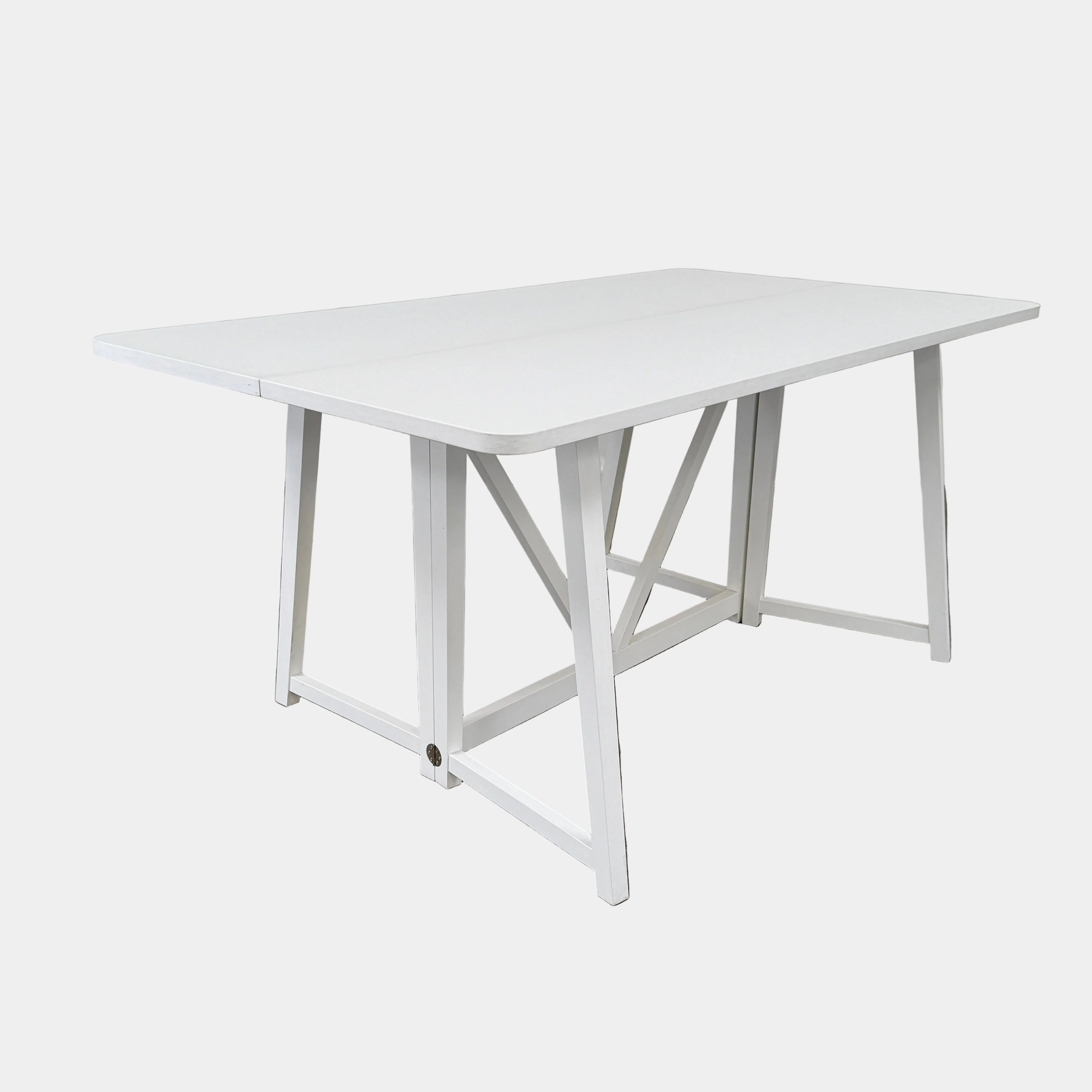 The Gervasoni Gray 51 Console/Table by Gervasoni, featuring a rectangular white design with a simple support frame, stands on a brown concrete floor against a plain white wall.