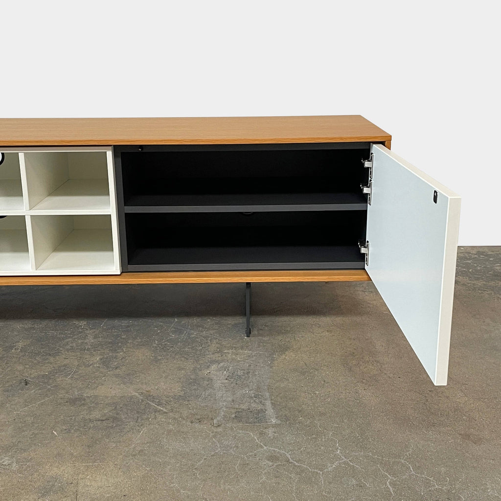 A Treku Aura Media Console, a modern tv stand with push-latch doors and drawers, is perfect for keeping your living space organized.