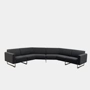 The Artifort More Mare Sectional by Artifort is a modern, dark gray sectional sofa featuring a minimalist metal frame and luxurious gray wool upholstery inspired by René Holten’s design, set against a plain white background.