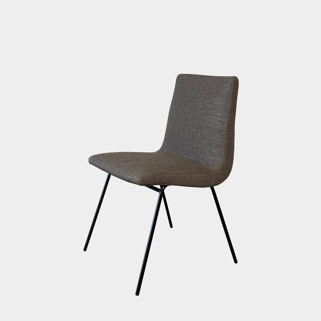 A Lignet Roset TV Side Chair with black legs designed by Pierre Paulin, offering comfort.