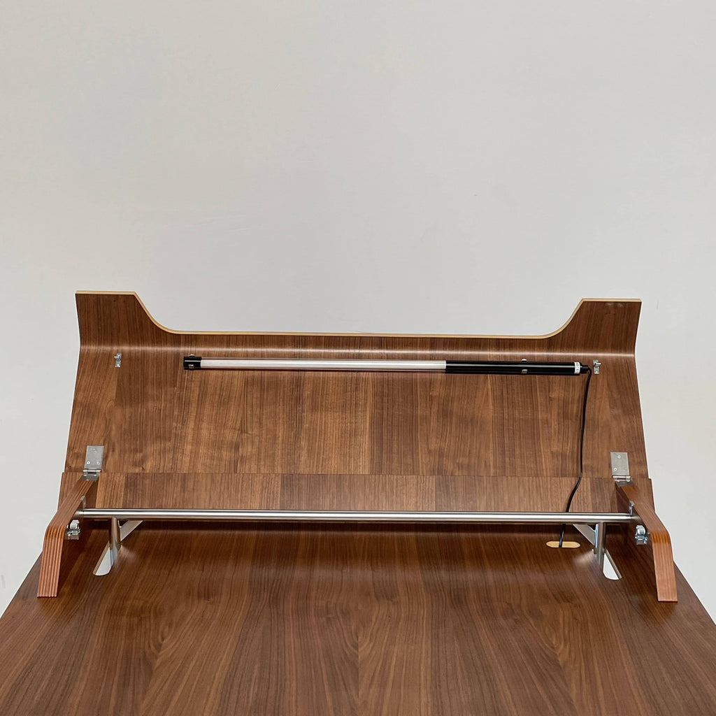 A ClassiCon Ajax Folding Writing Desk with a wooden top and metal legs made from multiplex birch-face veneer.