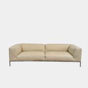 A beige B&B Italia Frank Sofa by B&B Italia, featuring metal legs and a minimalist modern design, is set against a plain white background.