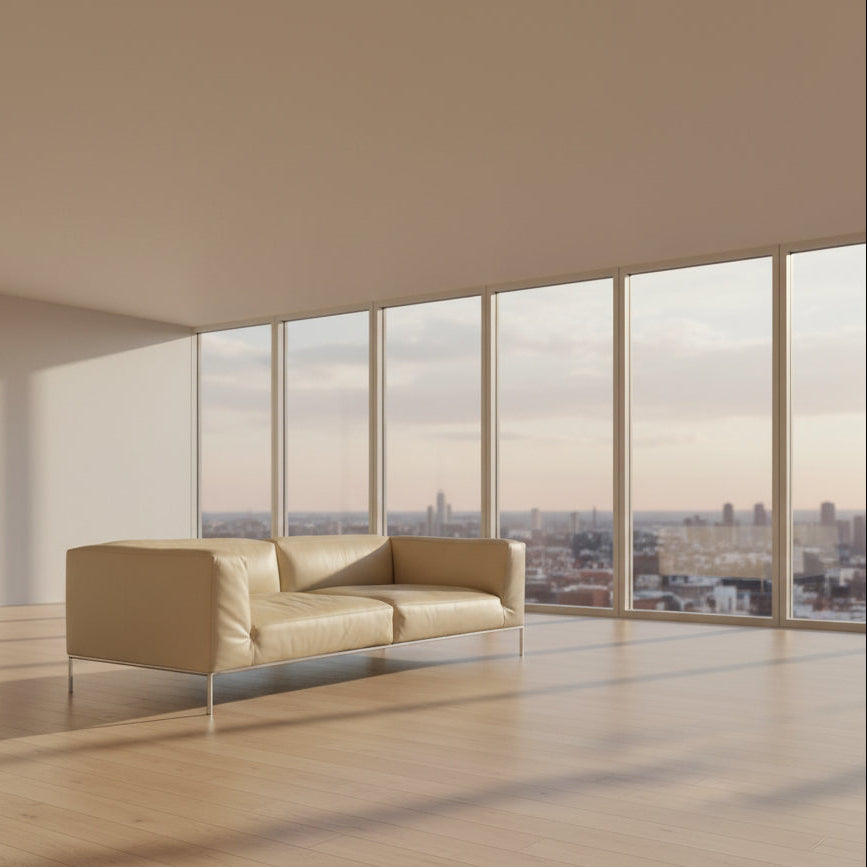 A beige B&B Italia Frank Sofa by B&B Italia, featuring metal legs and a minimalist modern design, is set against a plain white background.
