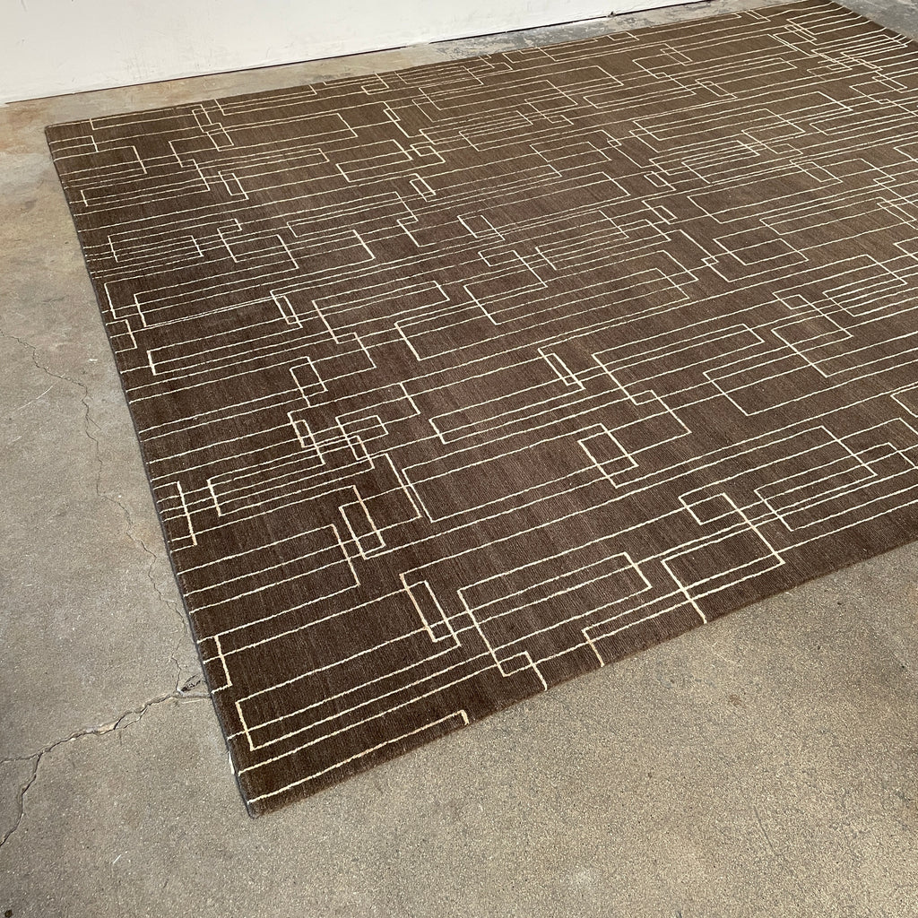 A brown and white Delinear Presence 8x10 Wool Rug with lines on it adds presence to any space.