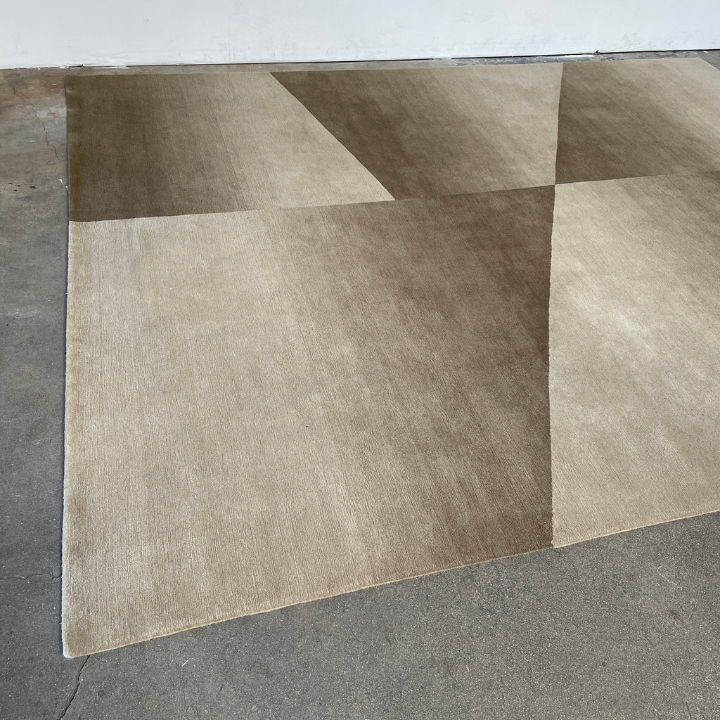 A Delinear Facet Cropped Beige & Cream 8'X10' Wool Rug on a white background.