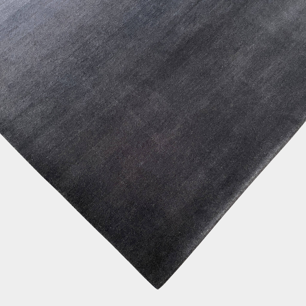 A Delinear Ombre Straight Fade 8' X 10' rug made from Himalayan wool.