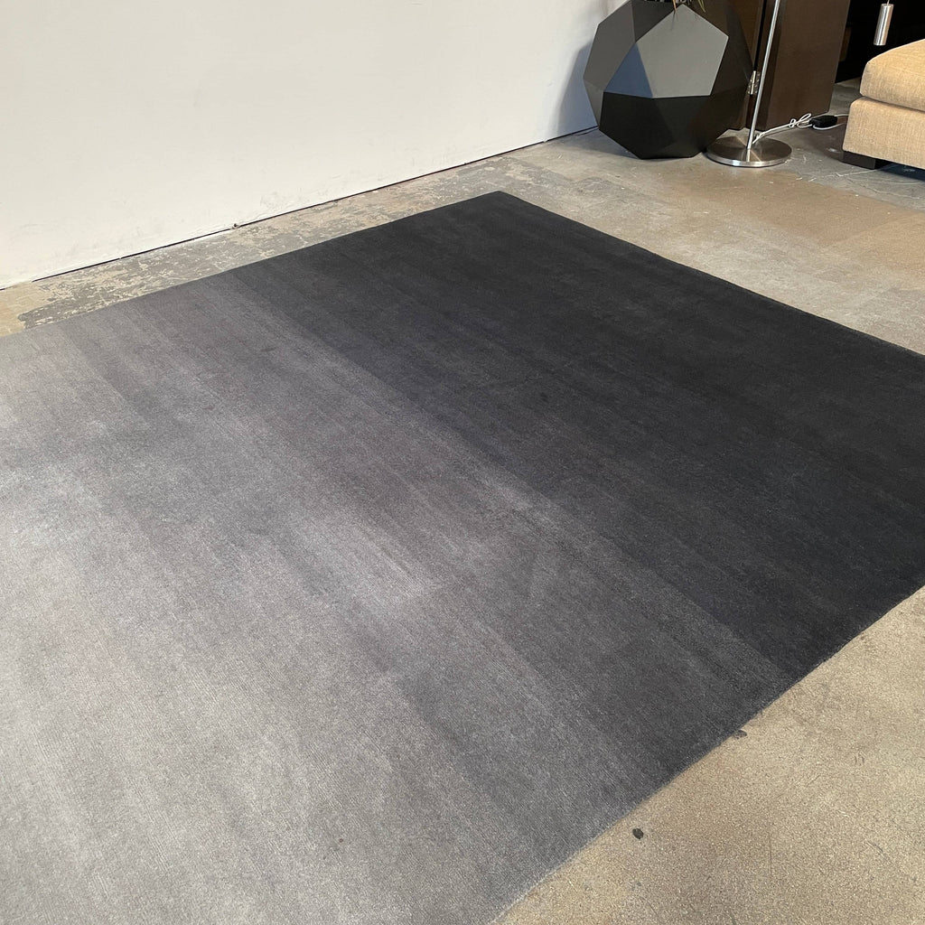 A Delinear Ombre Straight Fade 8' X 10' rug made from Himalayan wool.