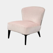 The Minotti Aston “Armchair” by Minotti features modern luxury with light pink upholstery and black wooden legs, showcased against a plain white background.