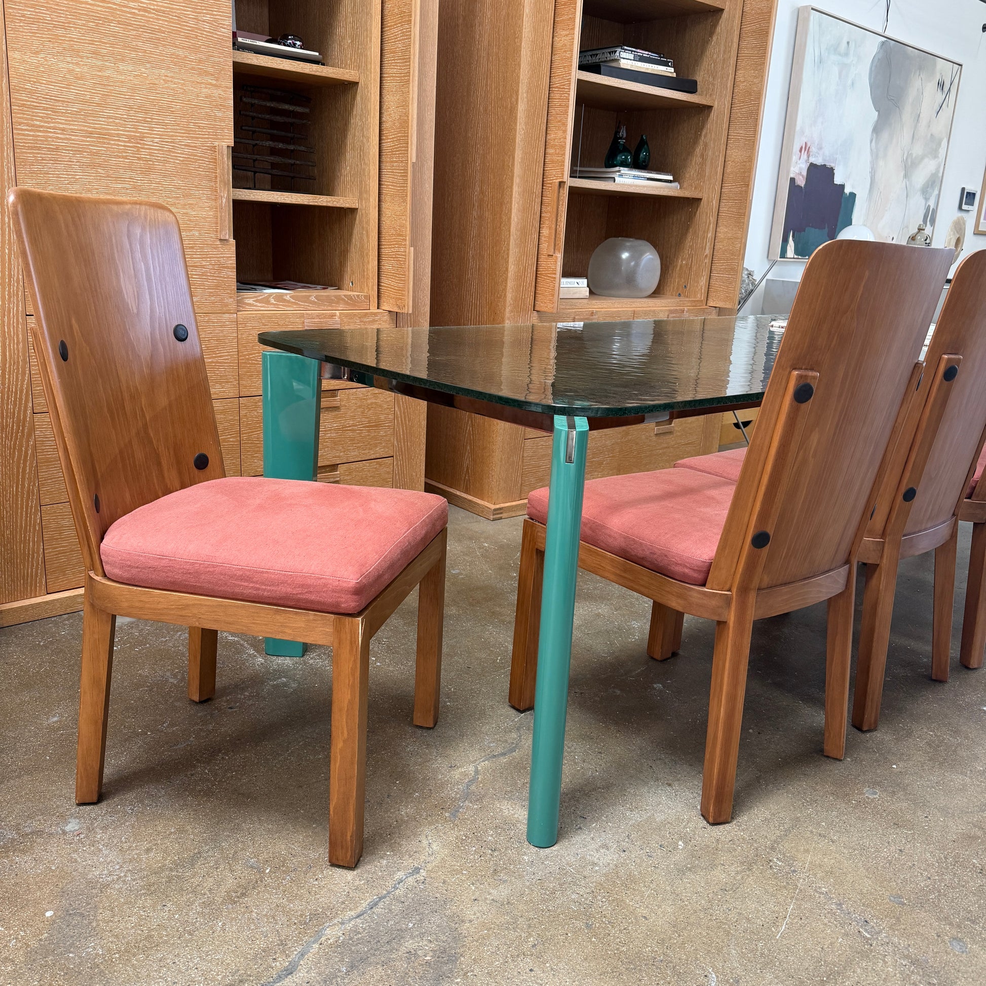A set of six Waldo's Designs dining chairs in the style of Axel Enar Lovo, featuring rectangular backs and coral upholstery, are neatly arranged in two rows against a plain white background.