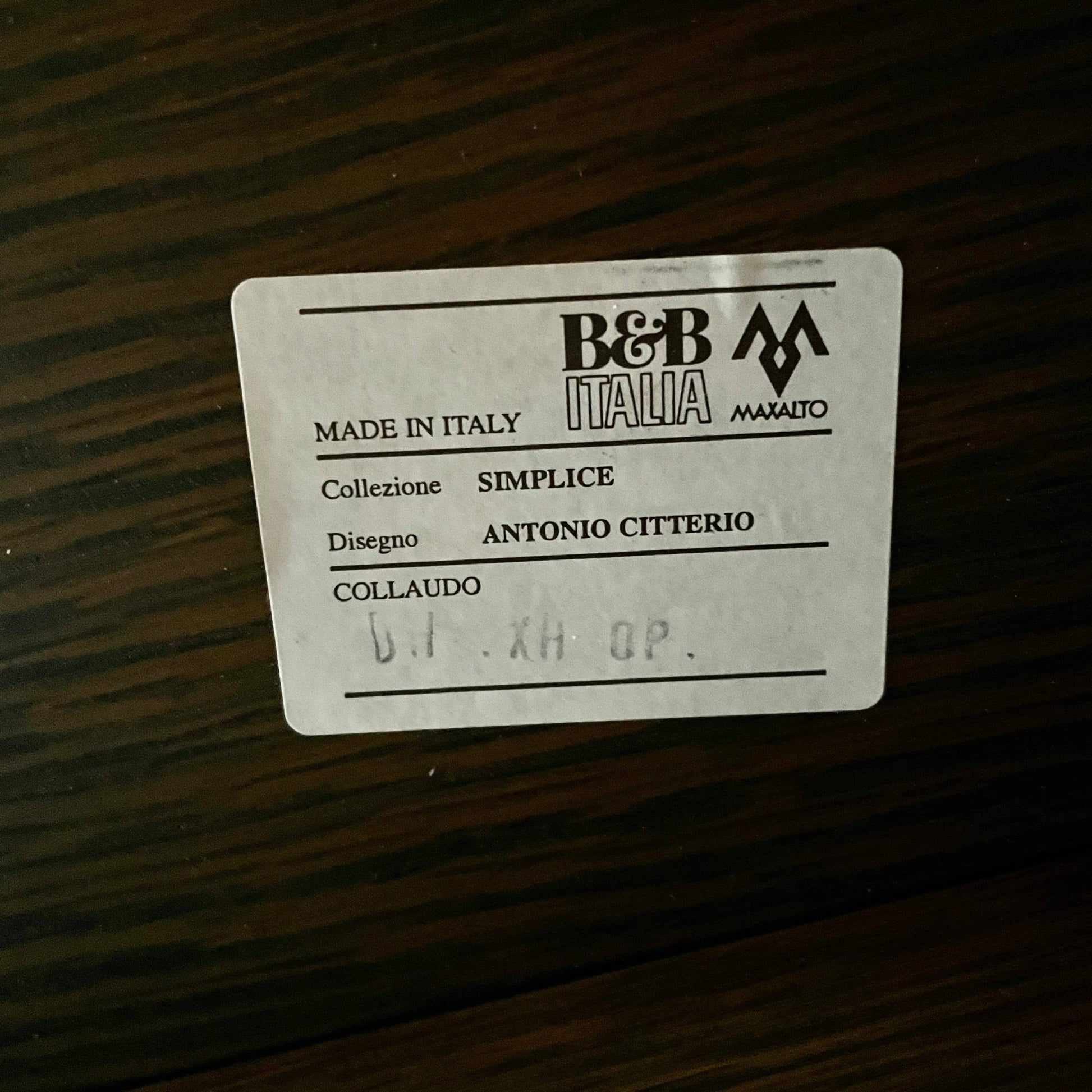 A wooden rectangular coffee table with a lower shelf and two supporting legs, reminiscent of a refined Maxalto Cicero Console by Maxalto.