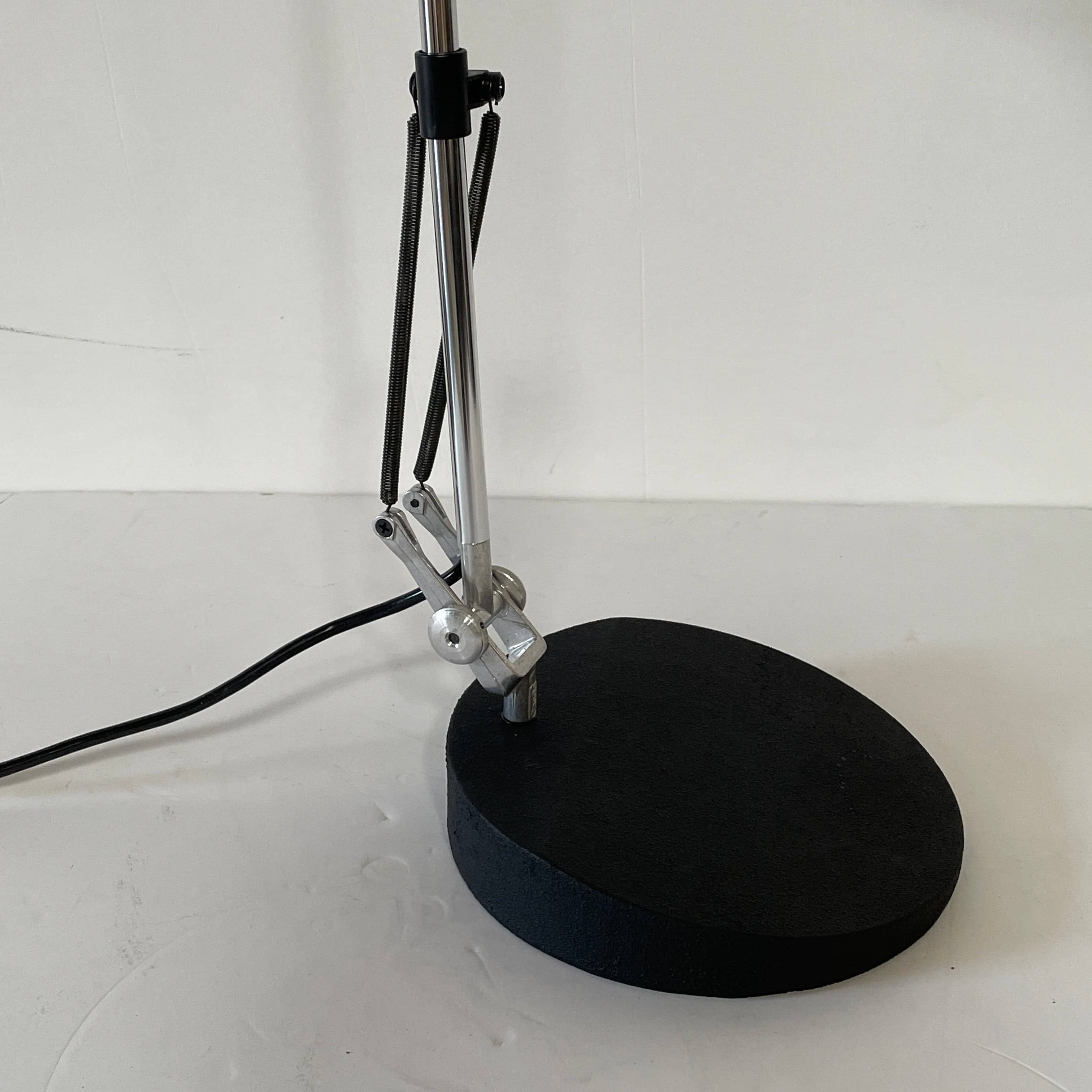 A Fontana Arte Chrono Task Lamp with a black shade and white background.