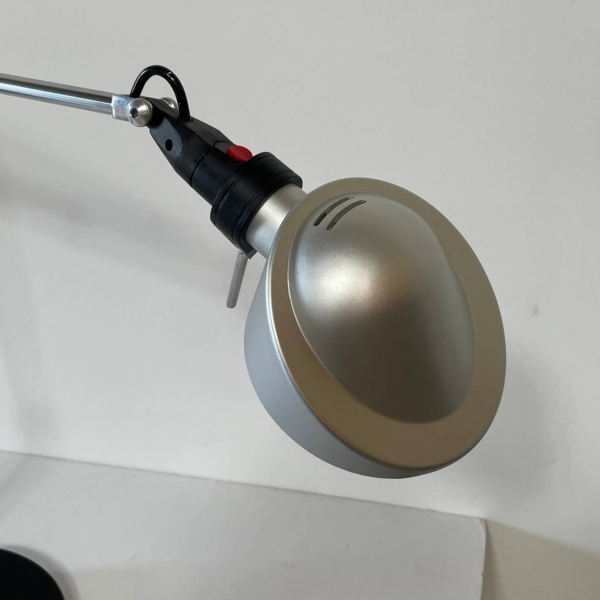 A Fontana Arte Chrono Task Lamp with a black shade and white background.