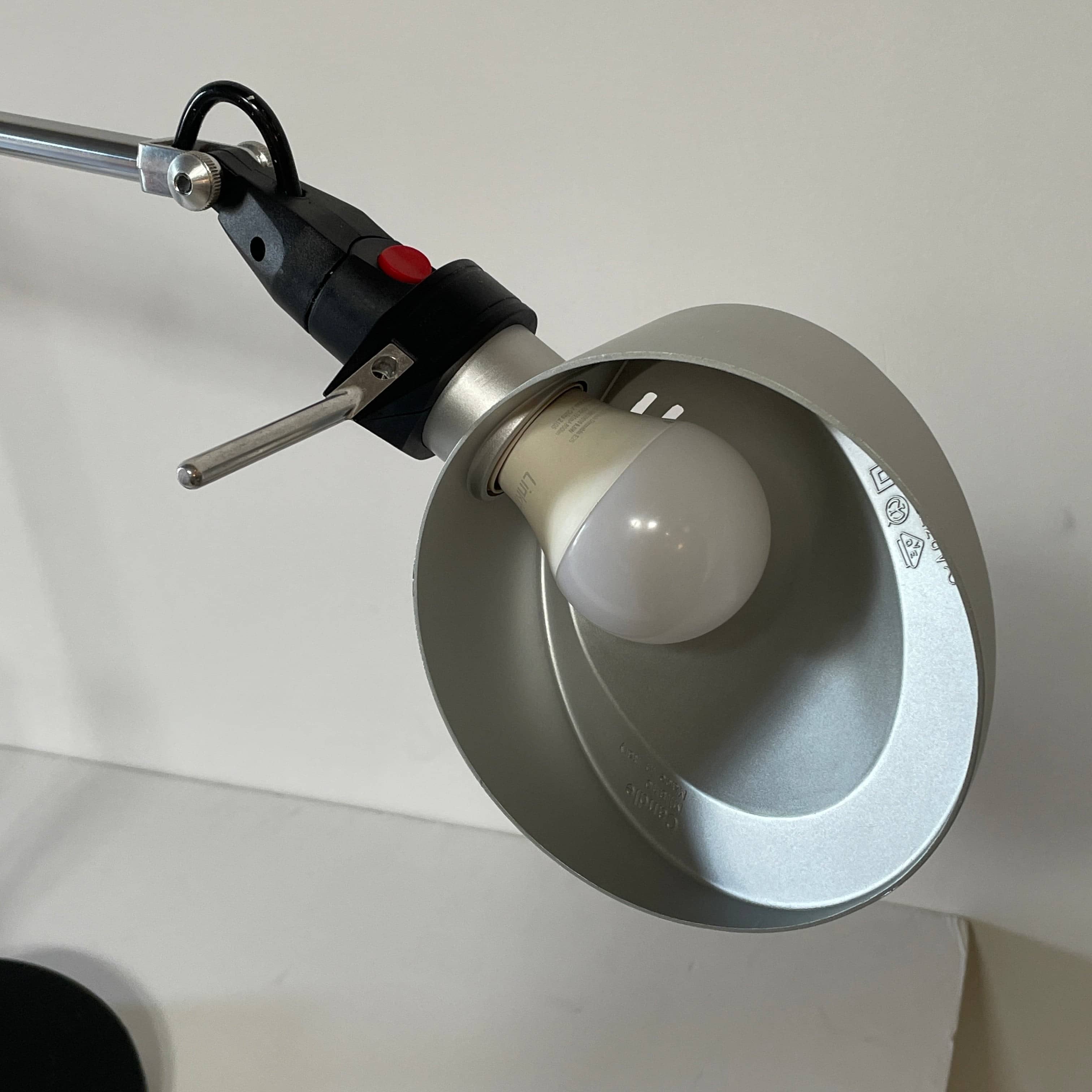 A Fontana Arte Chrono Task Lamp with a black shade and white background.