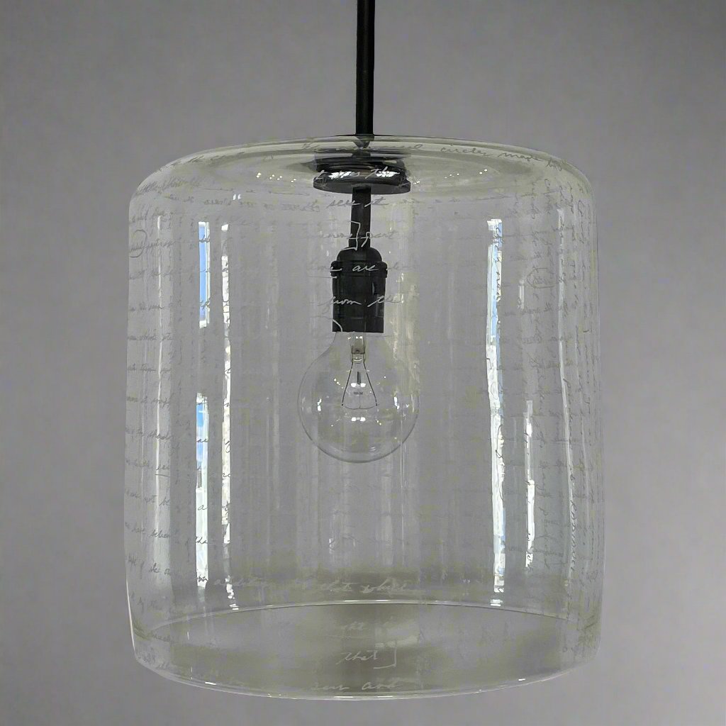 A unique functional art piece, this Alison Berger Word Pendant by Alison Berger showcases visible wires and mounting hardware against a white textured ceiling, reminiscent of Alison Berger's Word Pendant designs.