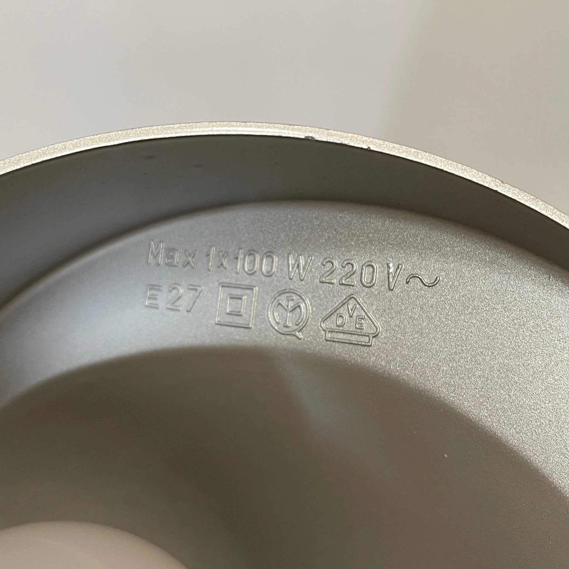 A Fontana Arte Chrono Task Lamp with a black shade and white background.