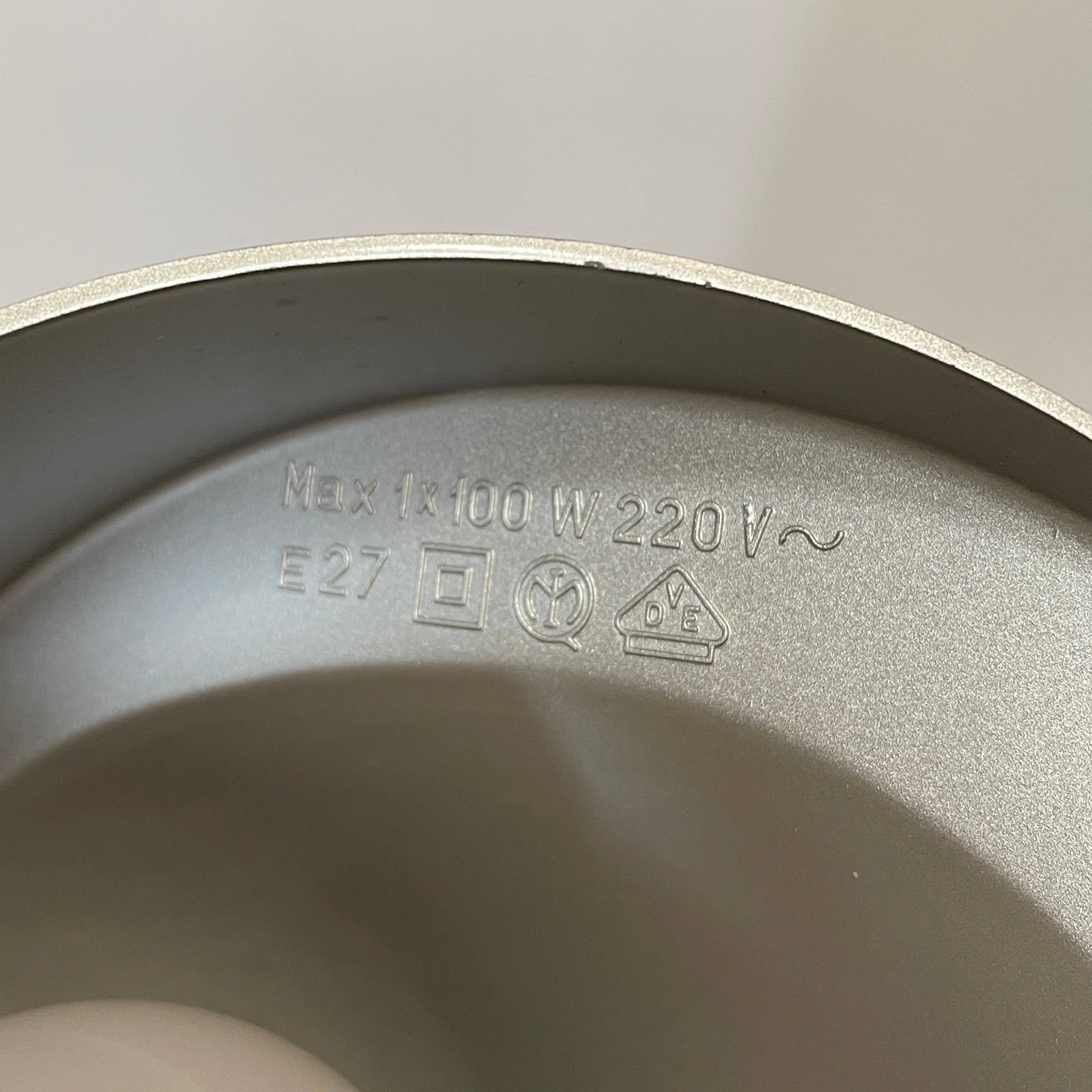 A Fontana Arte Chrono Task Lamp with a black shade and white background.