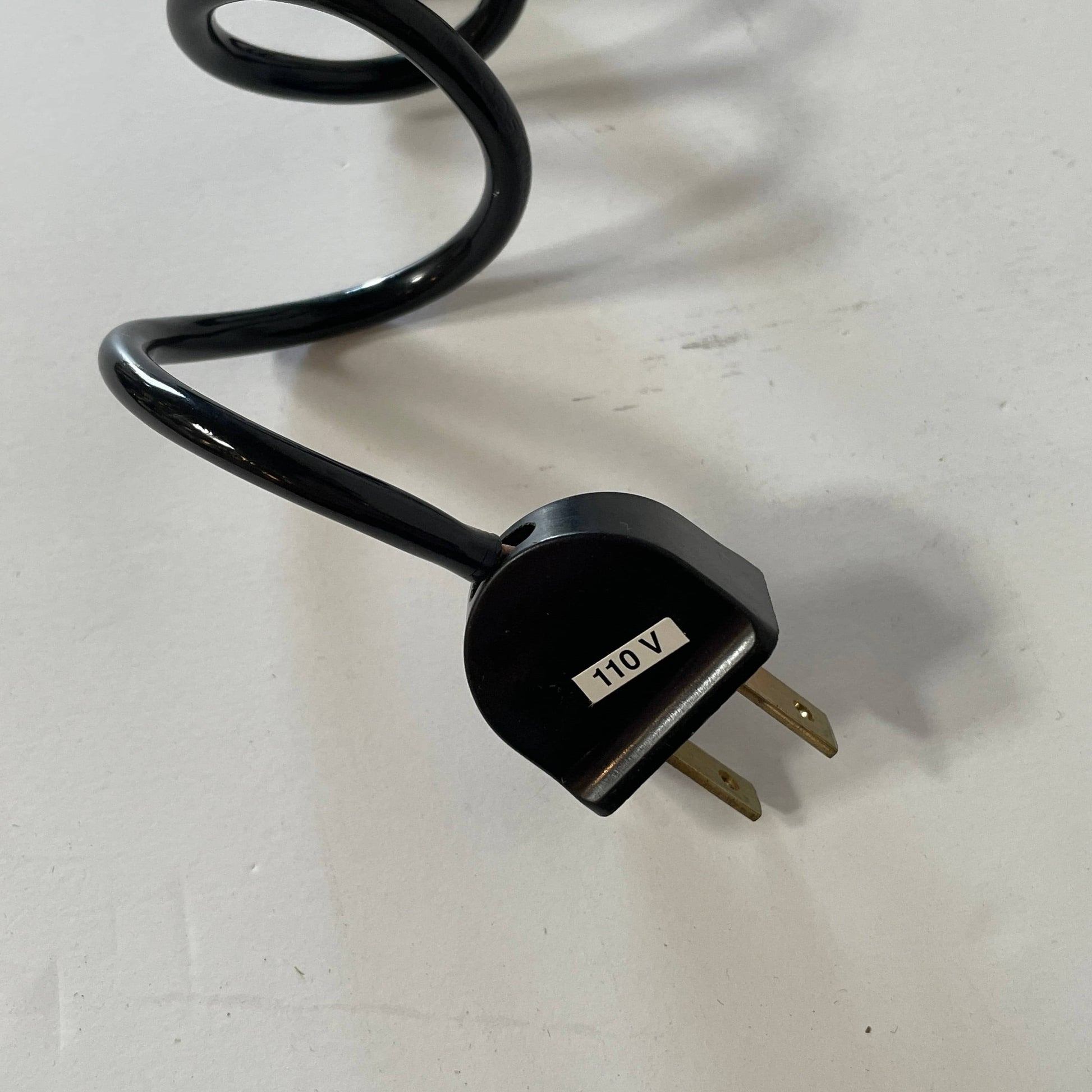 A Fontana Arte Chrono Task Lamp with a black shade and white background.