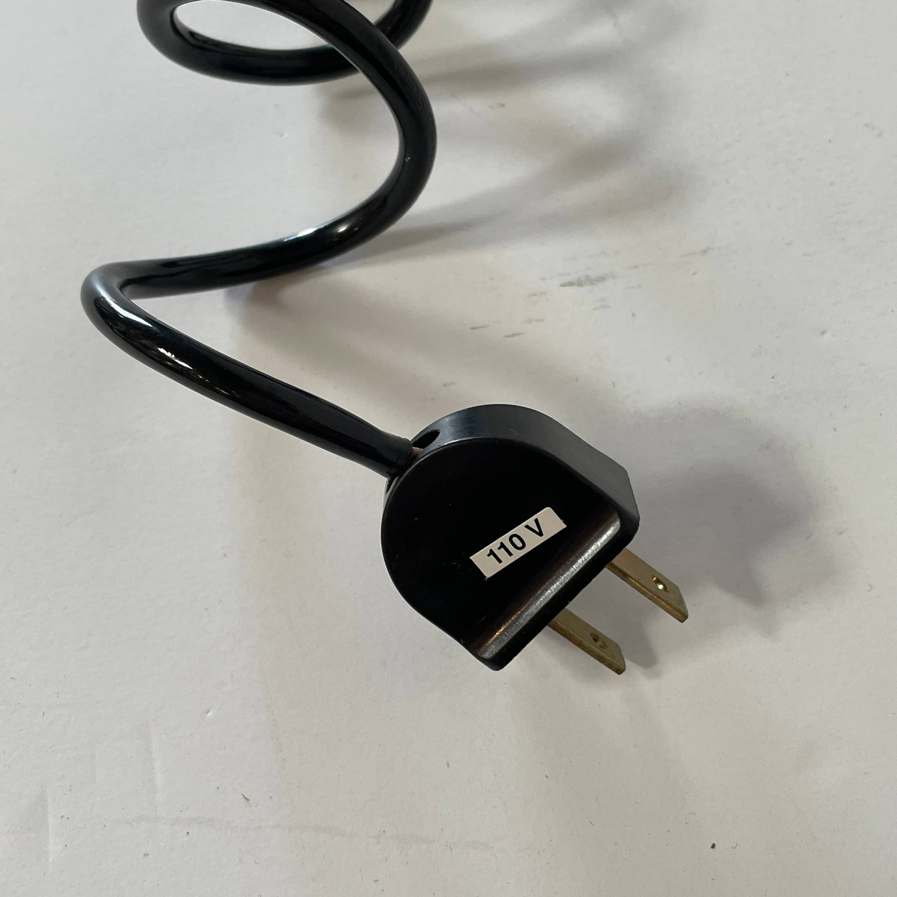 A Fontana Arte Chrono Task Lamp with a black shade and white background.